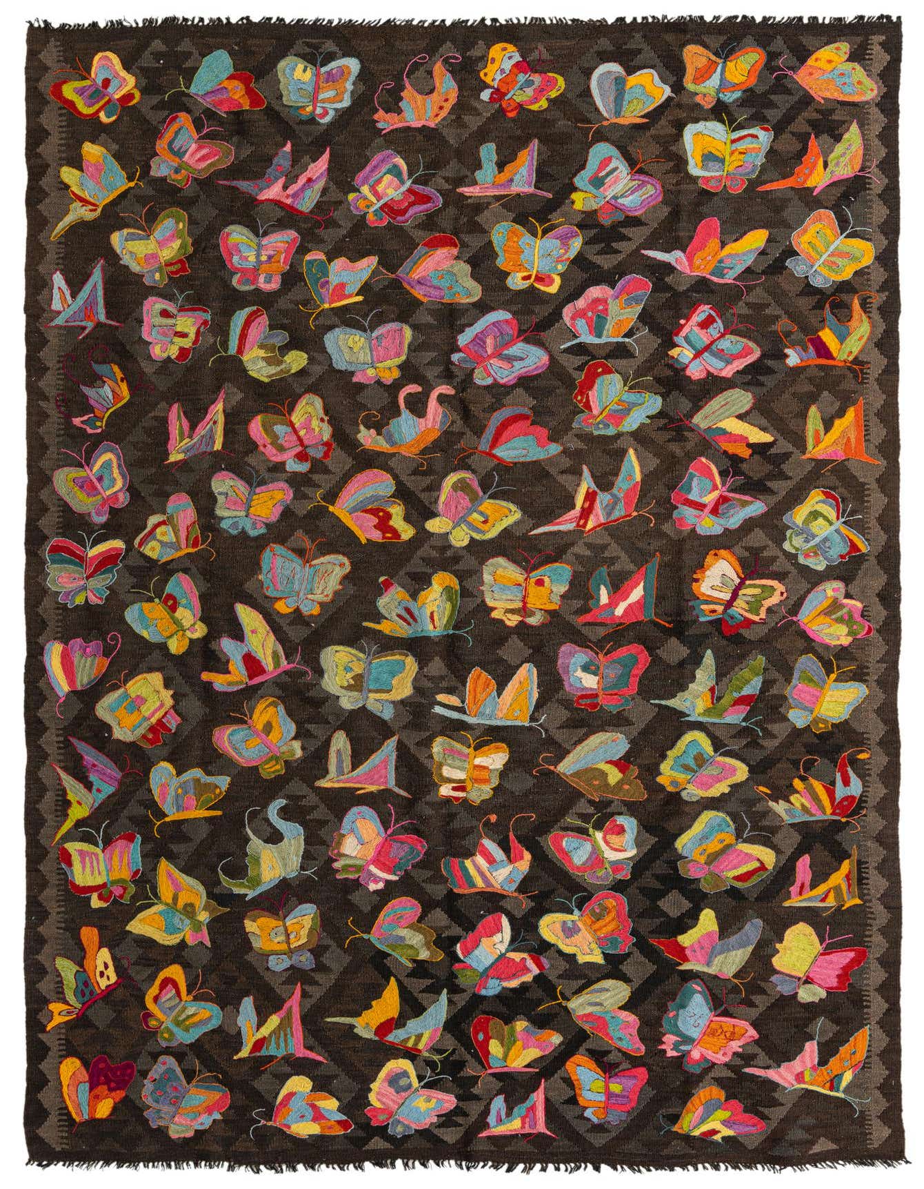 A 6x9 rectangular Kilim Suzani rug featuring a dark brown flatweave background with a geometric pattern, adorned with numerous colorful, embroidered butterfly motifs in various hues.