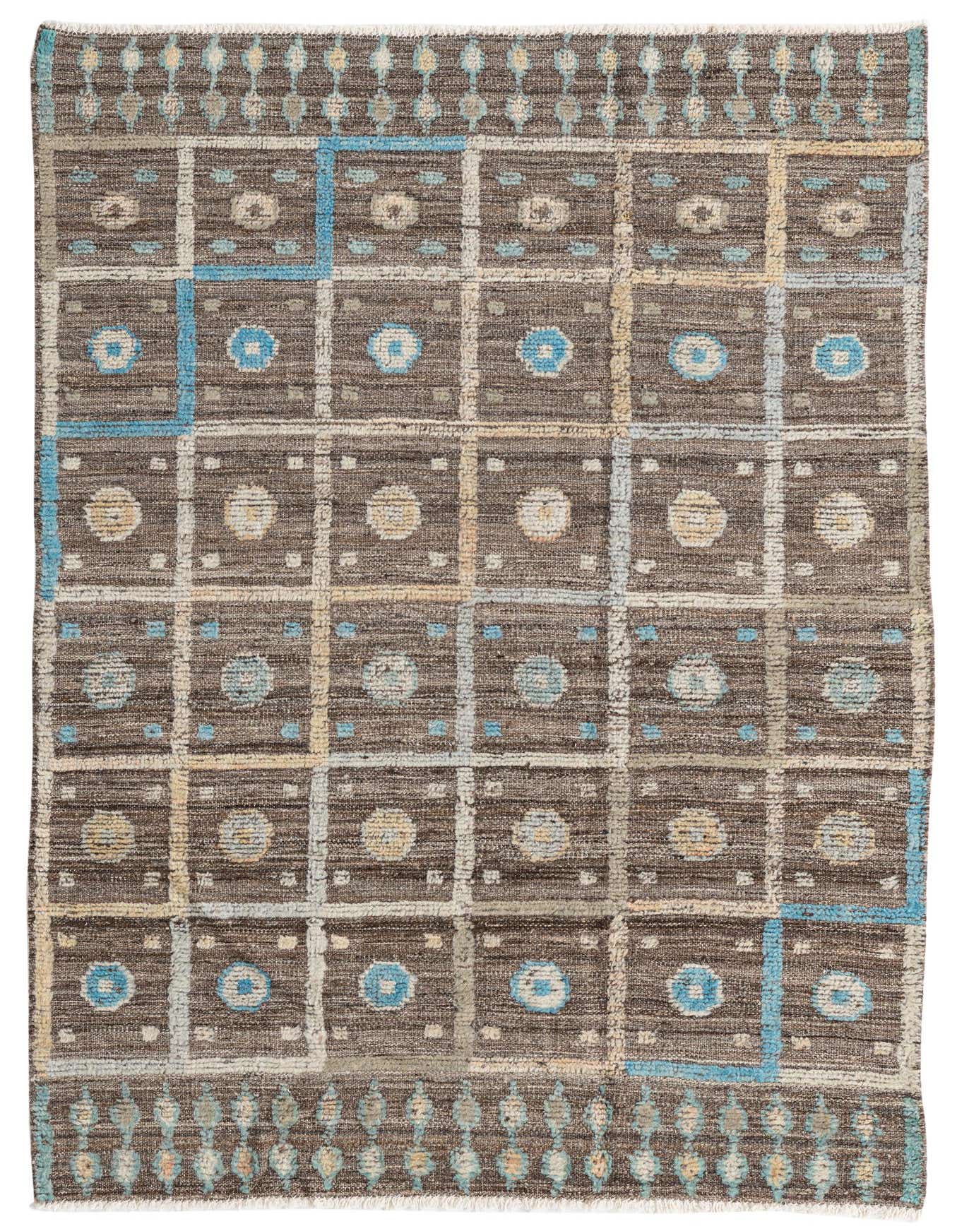 A 4x6 rectangular brown wool rug with a Southwestern-inspired grid pattern featuring blue and tan abstract motifs.