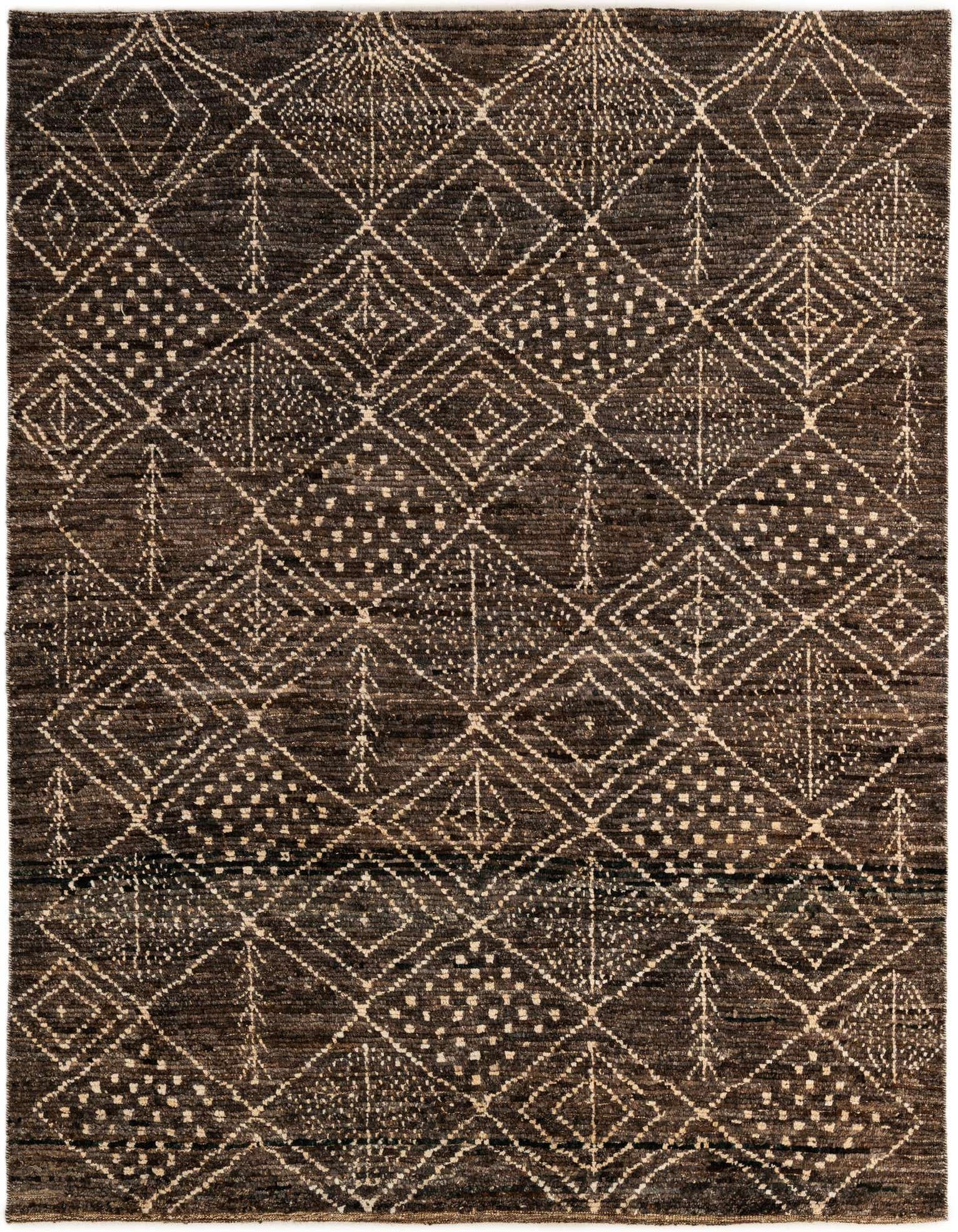 A 6x9 rectangular brown wool rug with a tribal modern diamond and dot pattern in tan, suitable for a living room.