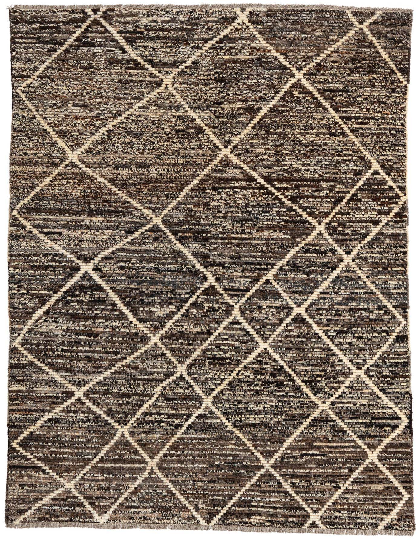 A 6x9 rectangular brown and tan tribal shag rug with a diamond pattern, suitable for a living room or bedroom.