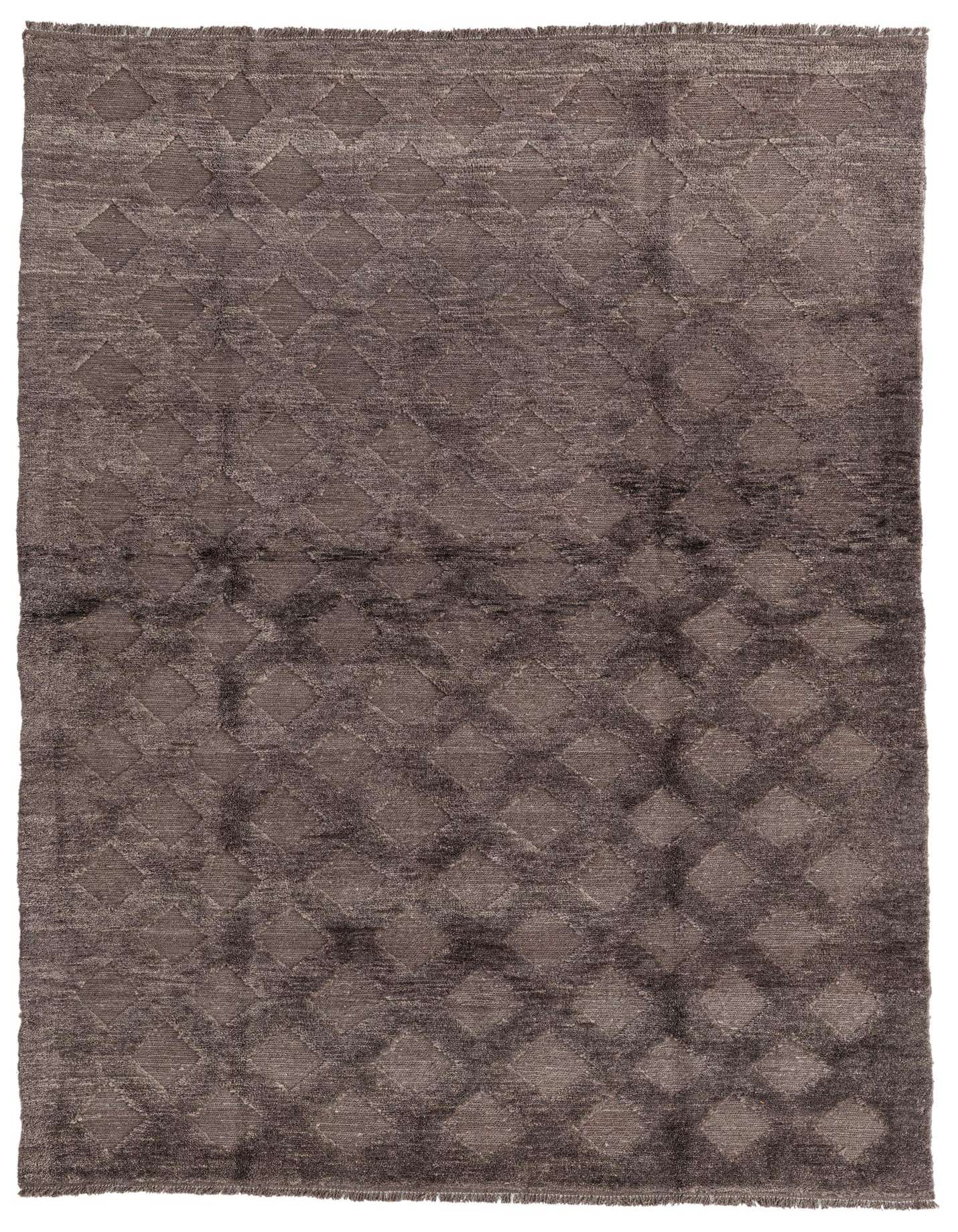 A 6x9 rectangular brown wool shag rug with a subtle tribal diamond pattern, perfect for a living room.