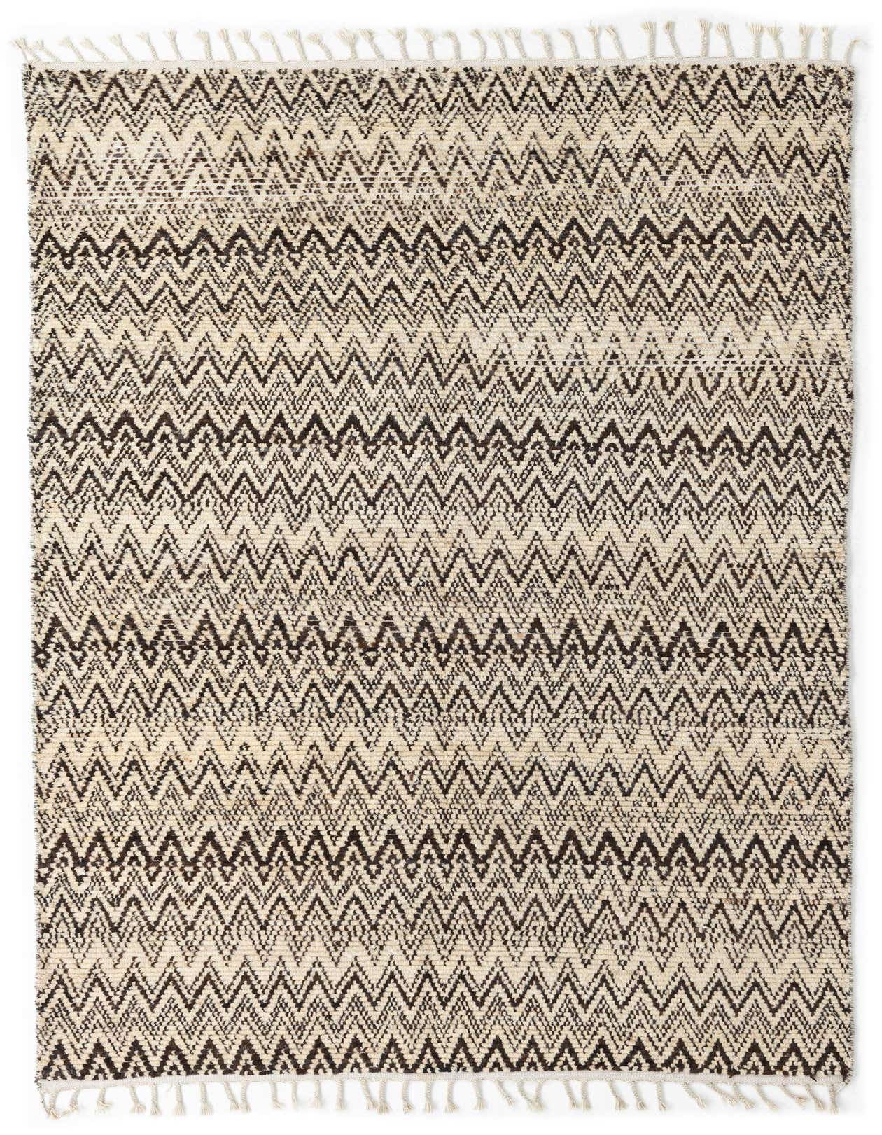 A 5x8 rectangular Moroccan shag rug in browns and tans, featuring a tribal zigzag pattern and fringe.