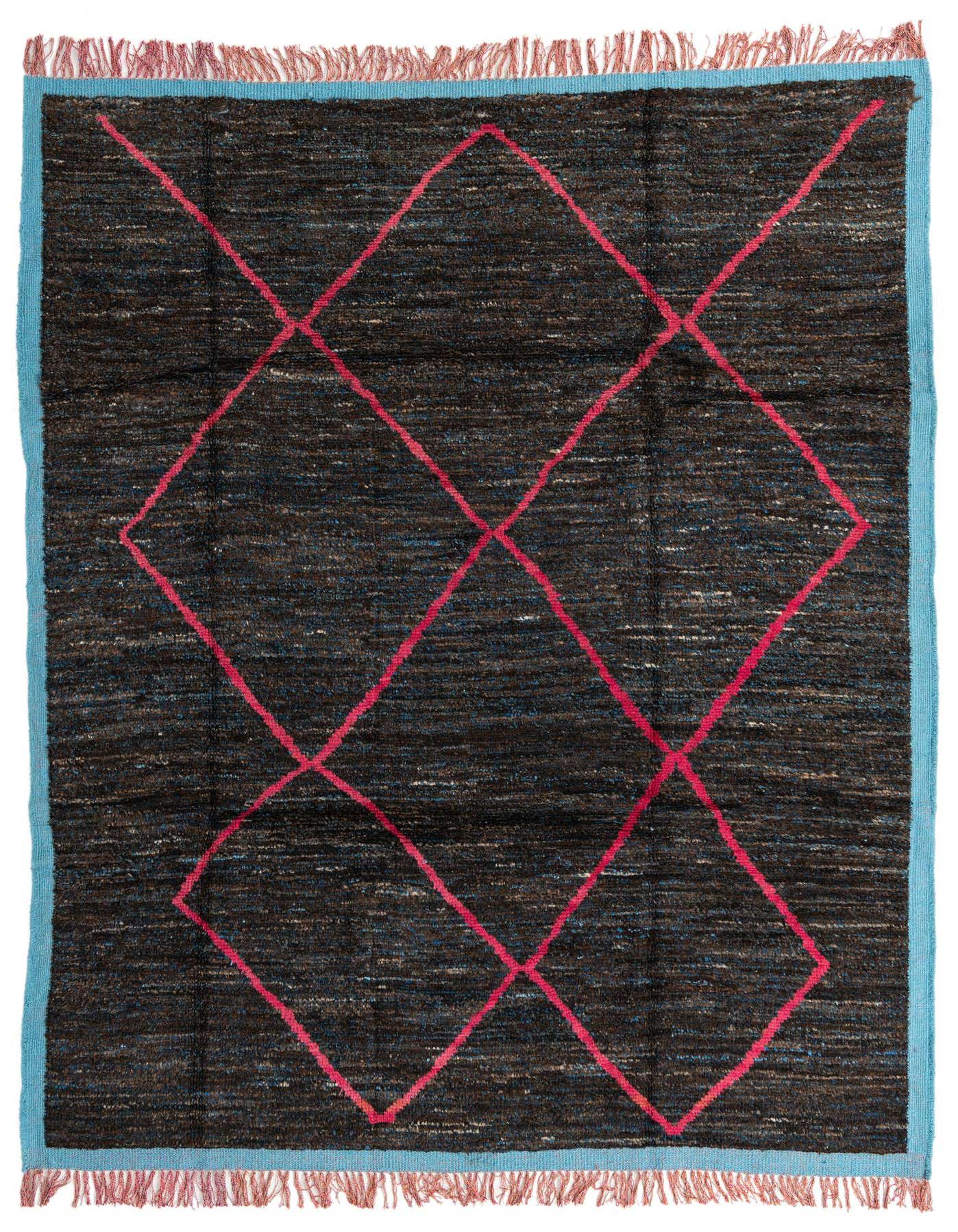 A 7x10 rectangular shag rug with a dark brown and tan base, featuring a bright pink diamond pattern and a light blue border with fringe.