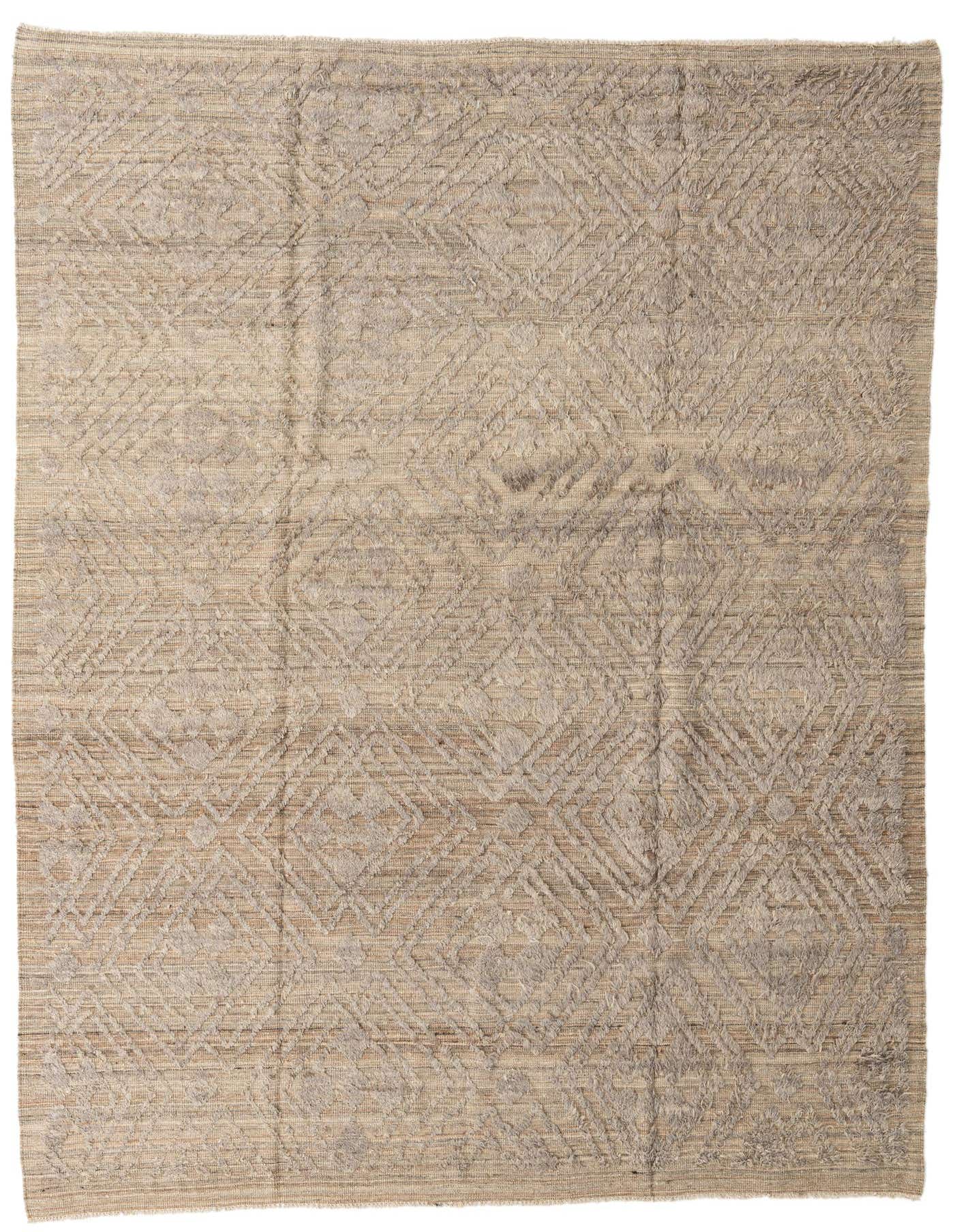 A 9x12 rectangular brown and tan tribal wool shag rug with a modern geometric pattern, suitable for a living room.