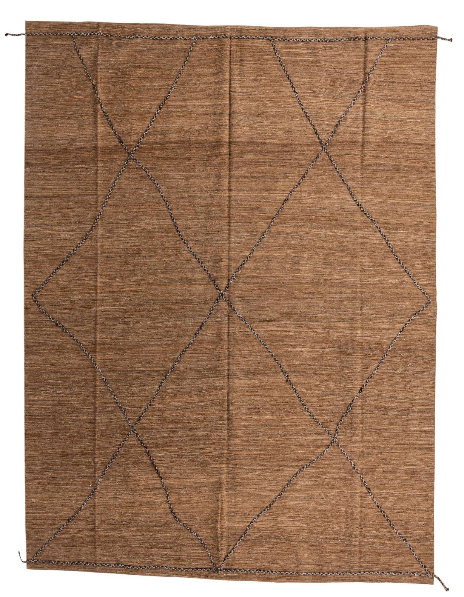 A large 12x15 rectangular brown wool shag rug featuring a subtle tribal diamond pattern made from darker brown stitching.
