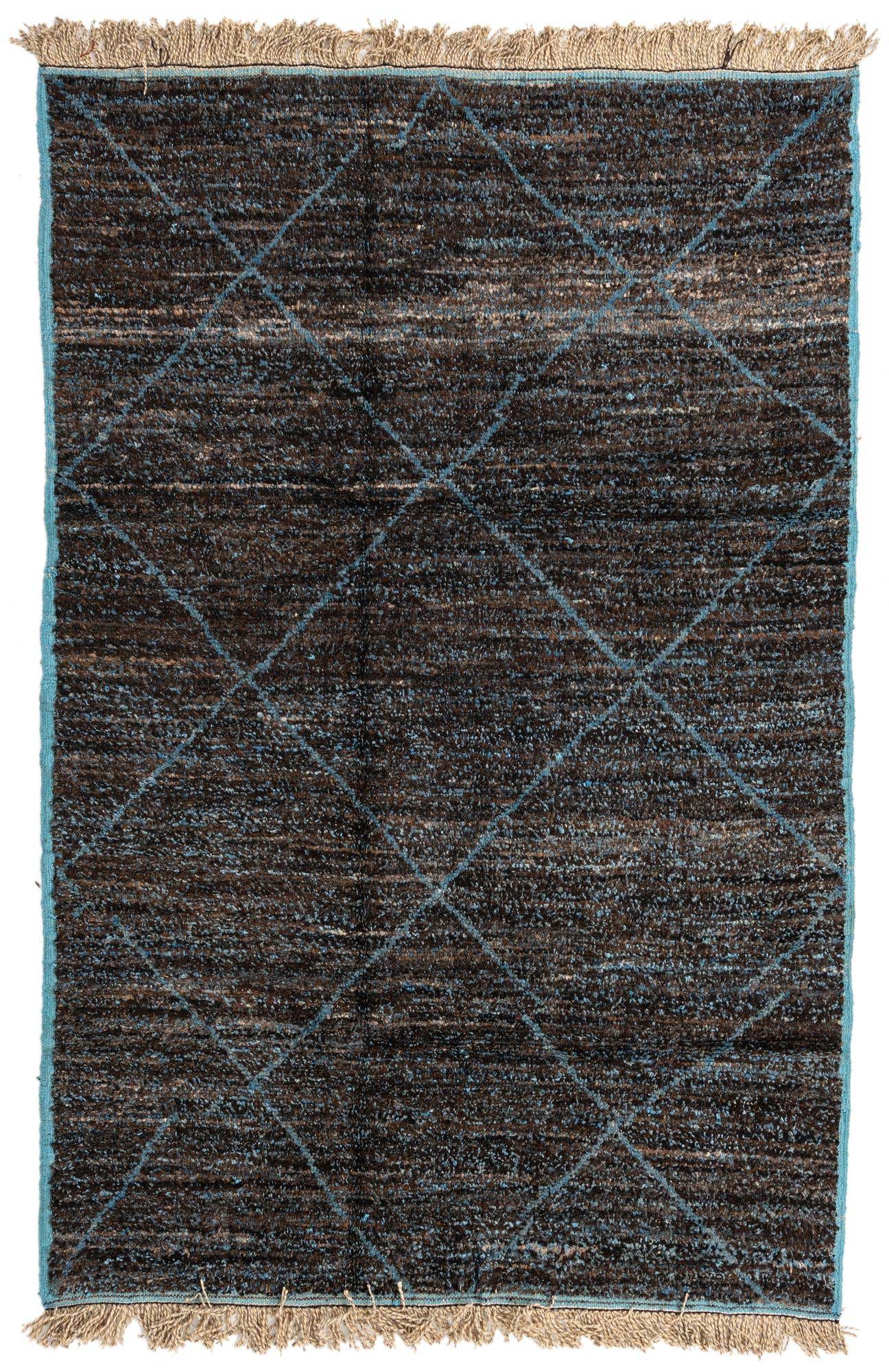 A 6x9 rectangular brown shag rug with a light blue diamond tribal pattern and fringed ends, suitable for a living room.