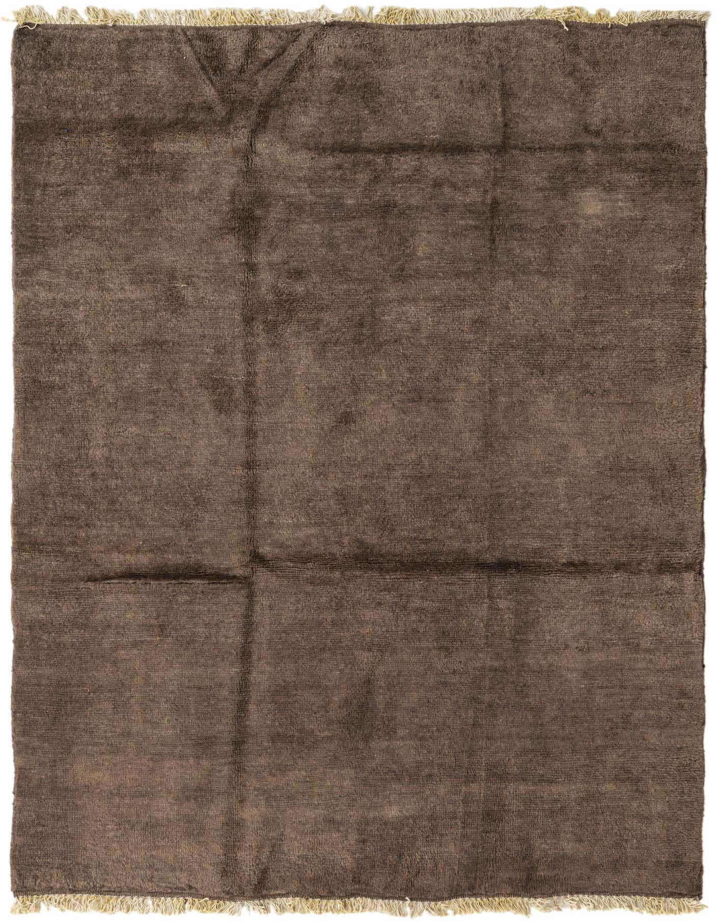 A 5x8 rectangular brown shag rug with a subtle tribal pattern and light fringe, perfect for a living room.