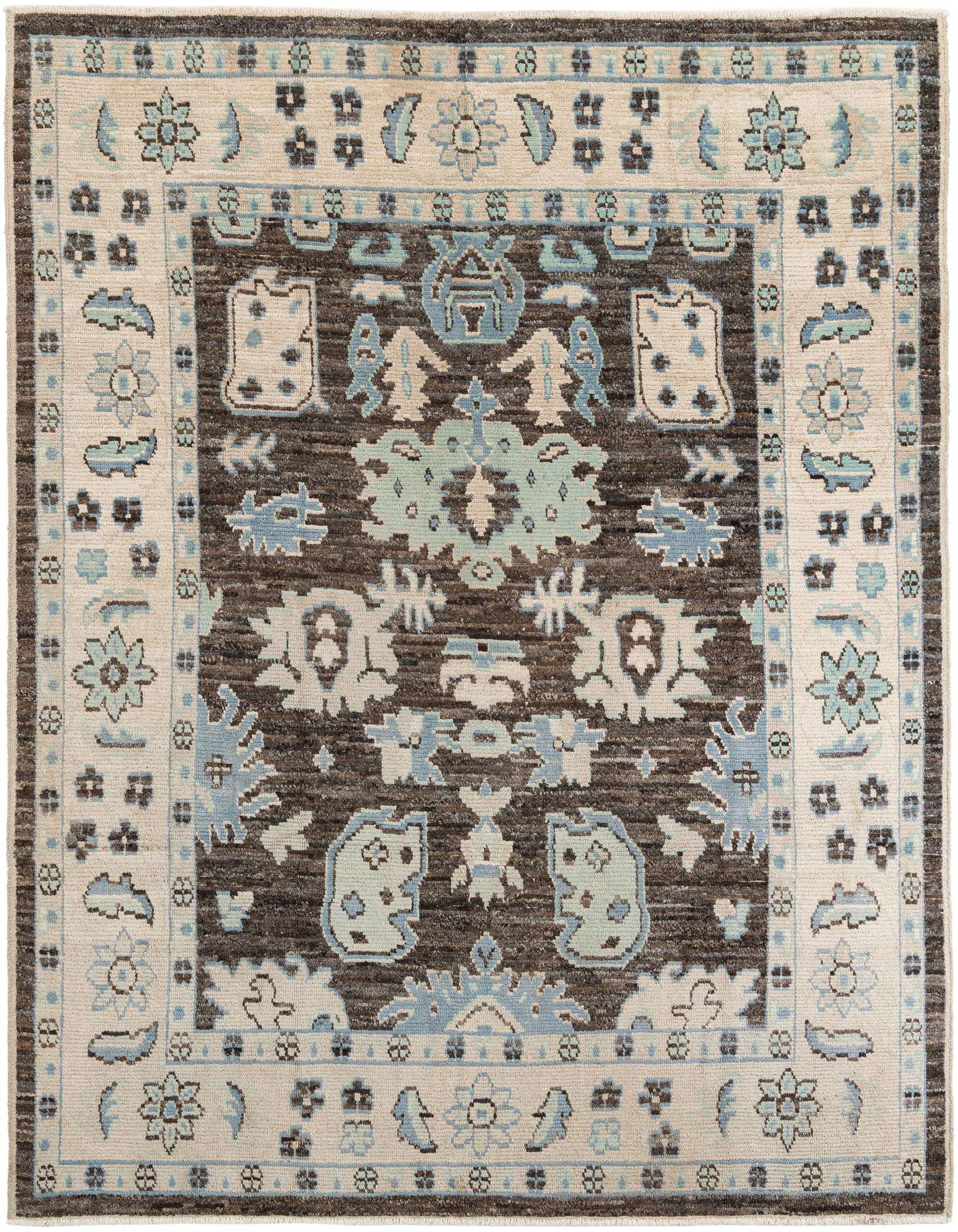 A rectangular 8x10 Moroccan tribal wool rug featuring a rich brown field with light blue, tan, and cream patterns, framed by a wide tan border with floral motifs.