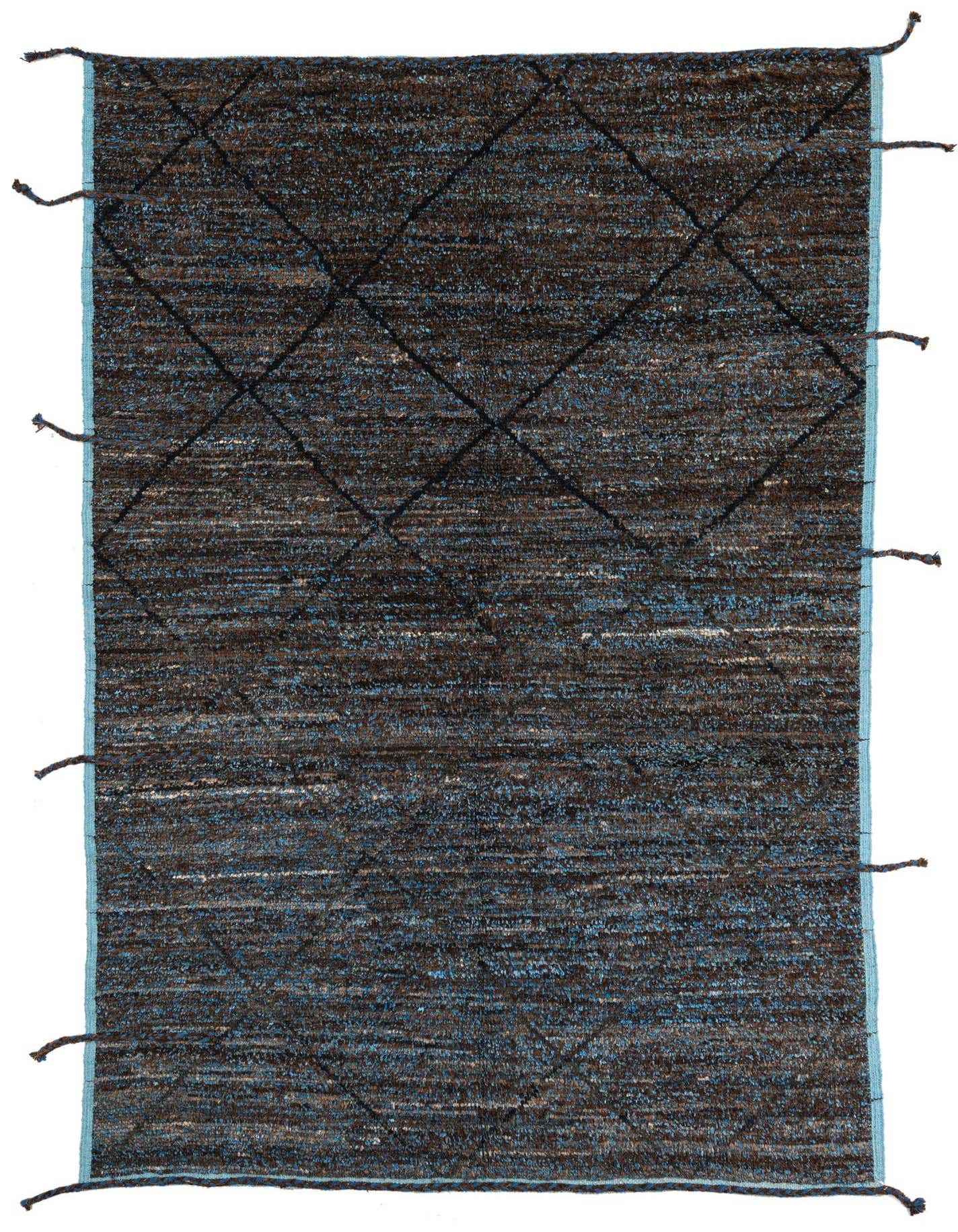 A 6x9 rectangular brown shag rug with a subtle tribal diamond pattern and light blue border, handmade from wool.