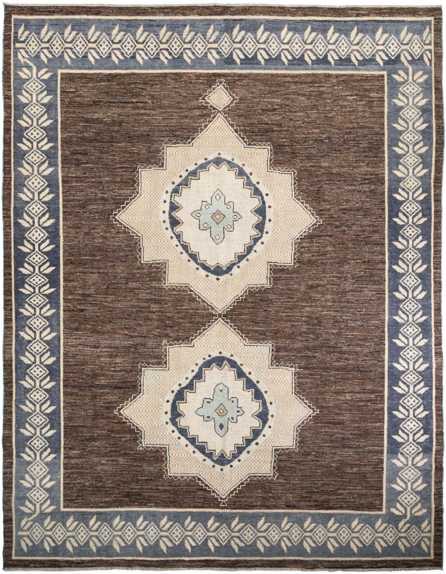 A 12x15 rectangular brown wool shag rug with a blue and tan tribal medallion pattern.