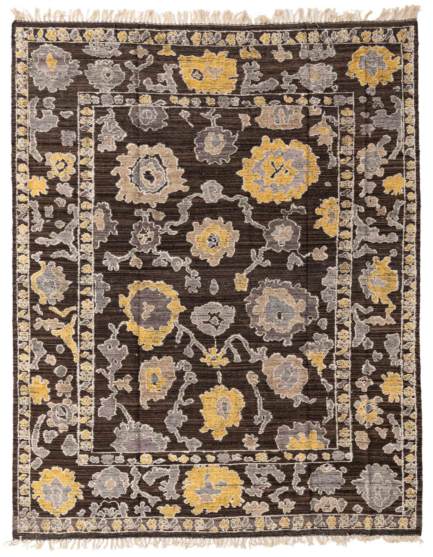A 9x12 rectangular Oushak rug with a modern abstract floral pattern in brown, tan, and yellow, with fringe.