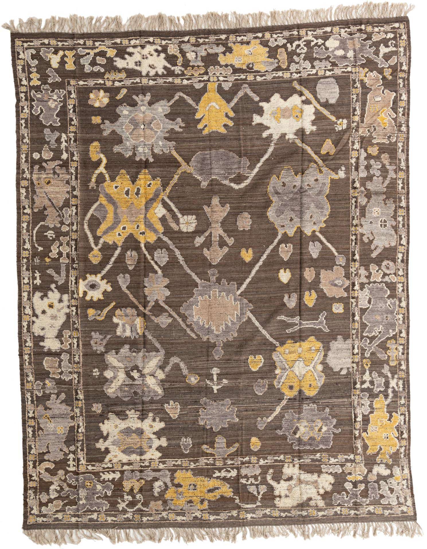 A 9x12 rectangular Oushak rug with a modern abstract pattern in browns, tans, and hints of yellow, featuring a decorative border and fringe.