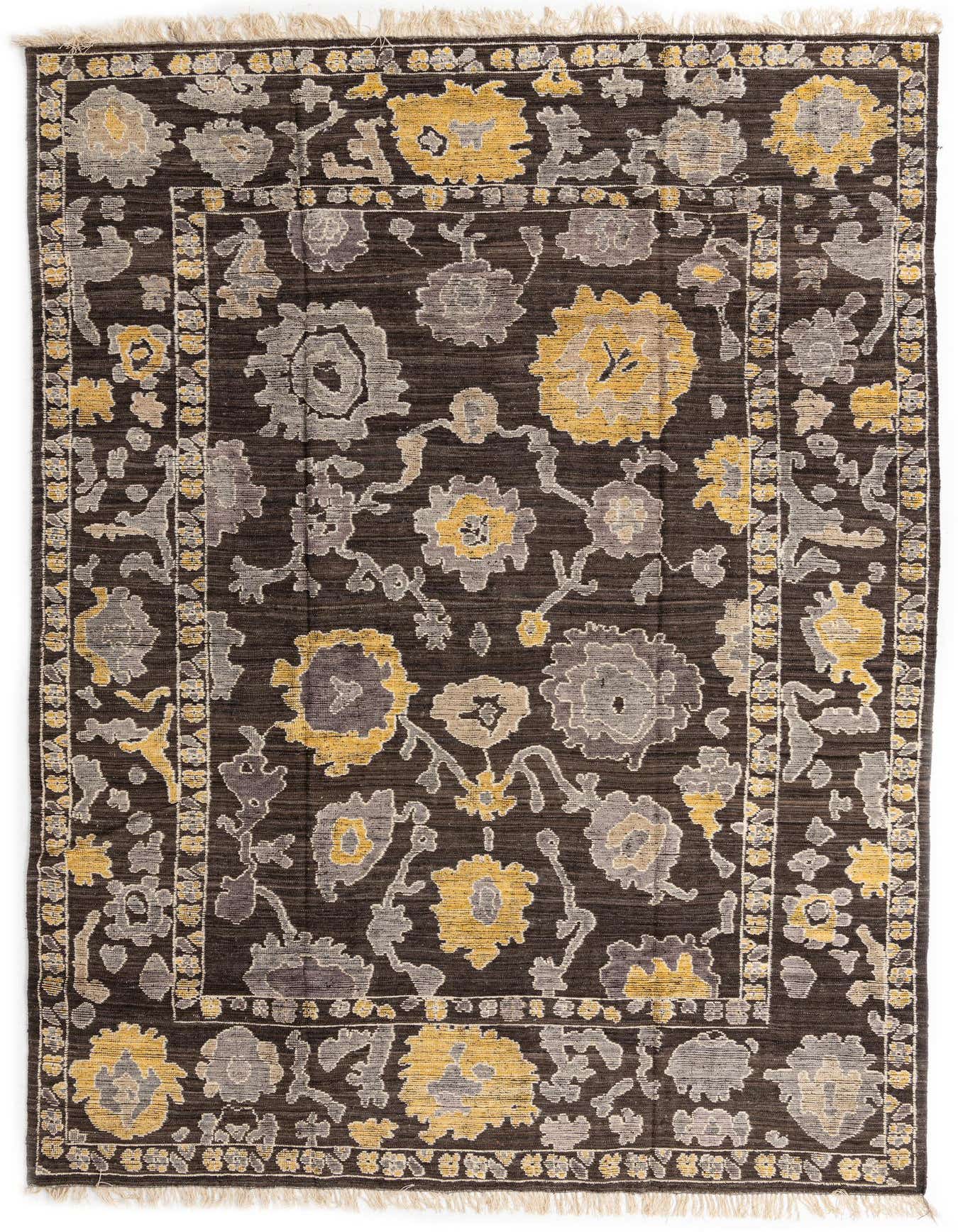 A rectangular 10x14 Oushak rug in brown with abstract yellow and gray floral patterns, featuring a medium pile and fringed ends.