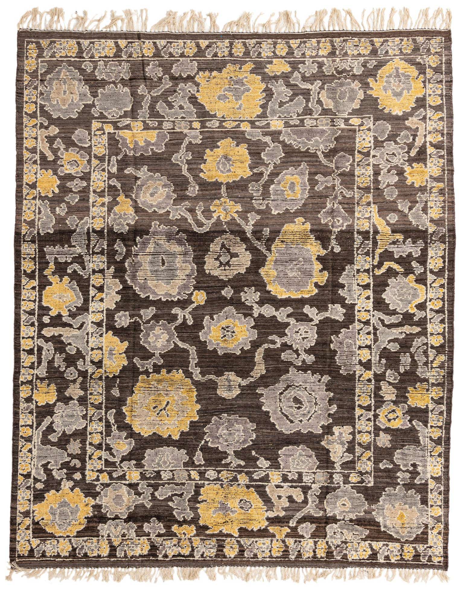 A rectangular 8x10 Oushak wool rug in brown and tan with a modern abstract floral pattern and fringed edges.