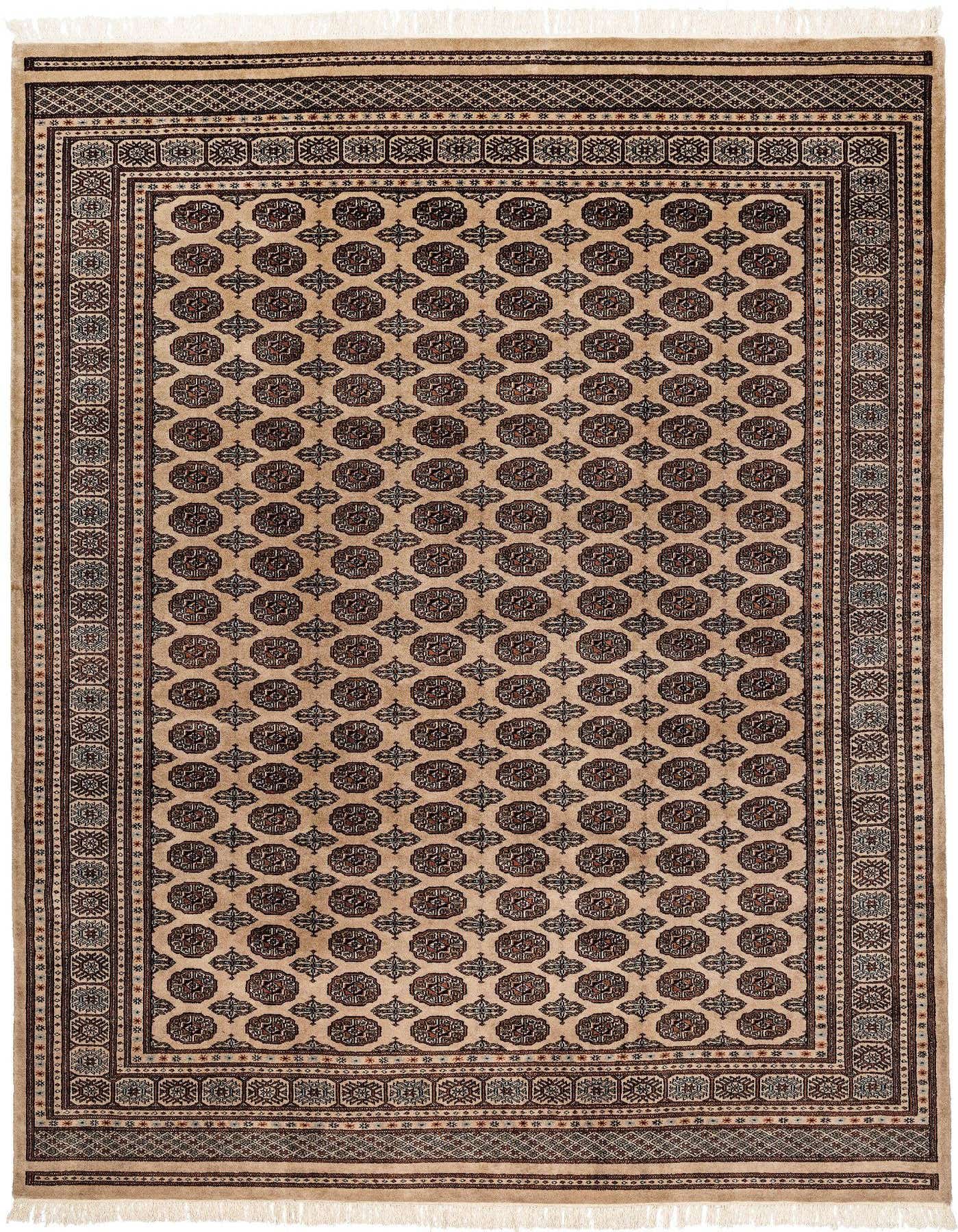A 6x9 rectangular Rugs.com Torkman wool rug in browns and tans with a traditional medallion pattern and fringe.
