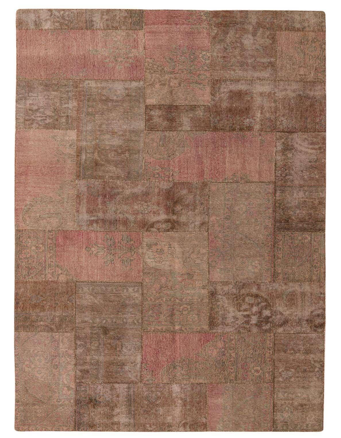 A 9x12 rectangular patchwork rug featuring various shades of brown and tan, with subtle pink and faded traditional patterns, ideal for a living room.