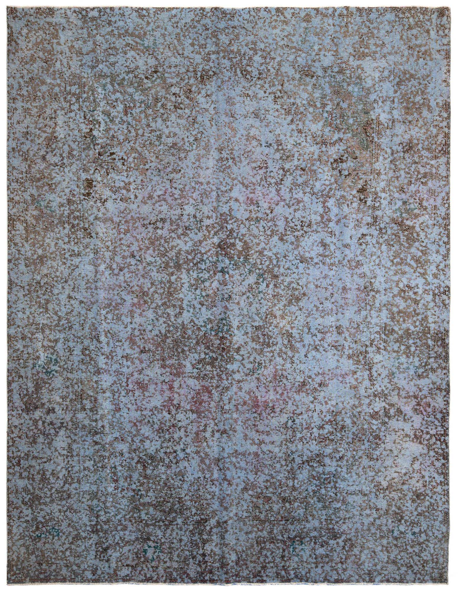 A 10x13 rectangular Persian-style area rug featuring an abstract, distressed pattern in various shades of brown and tan.
