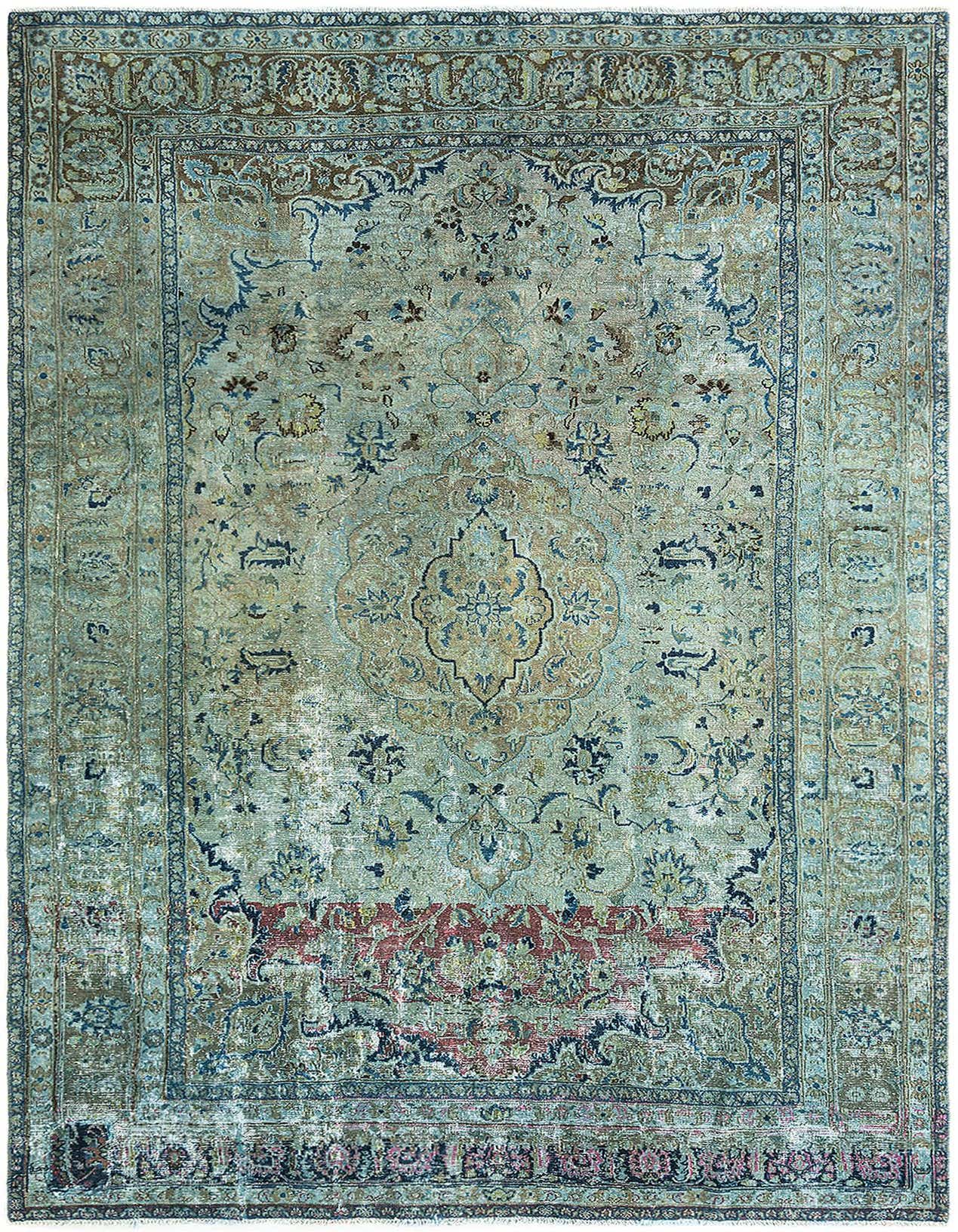 A 7x10 rectangular brown and tan vintage wool rug with an intricate floral medallion pattern and distressed finish.