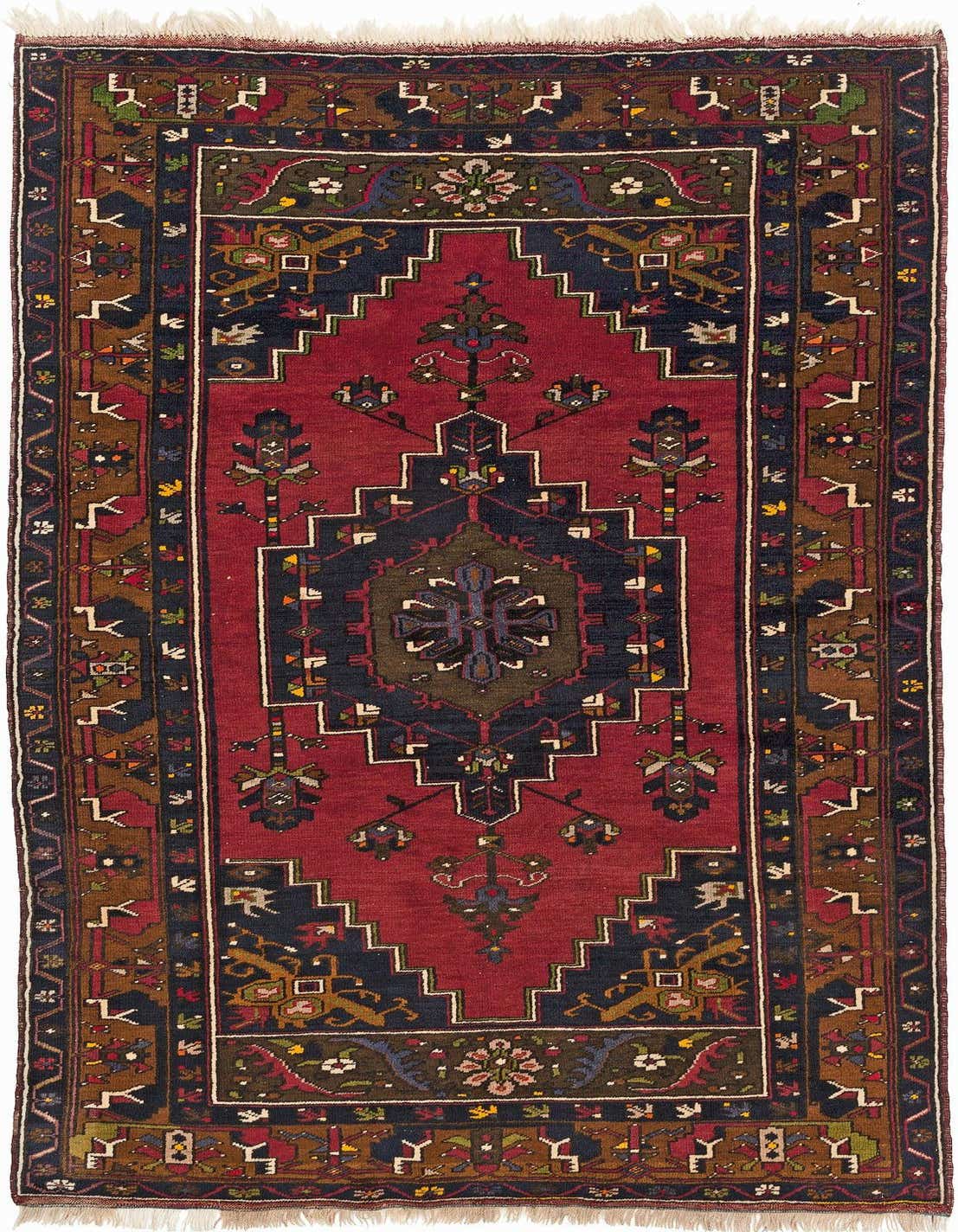 A 5x8 rectangular Yahyali rug featuring a traditional geometric pattern in rich reds, browns, and navy blue, with intricate motifs and fringed ends.