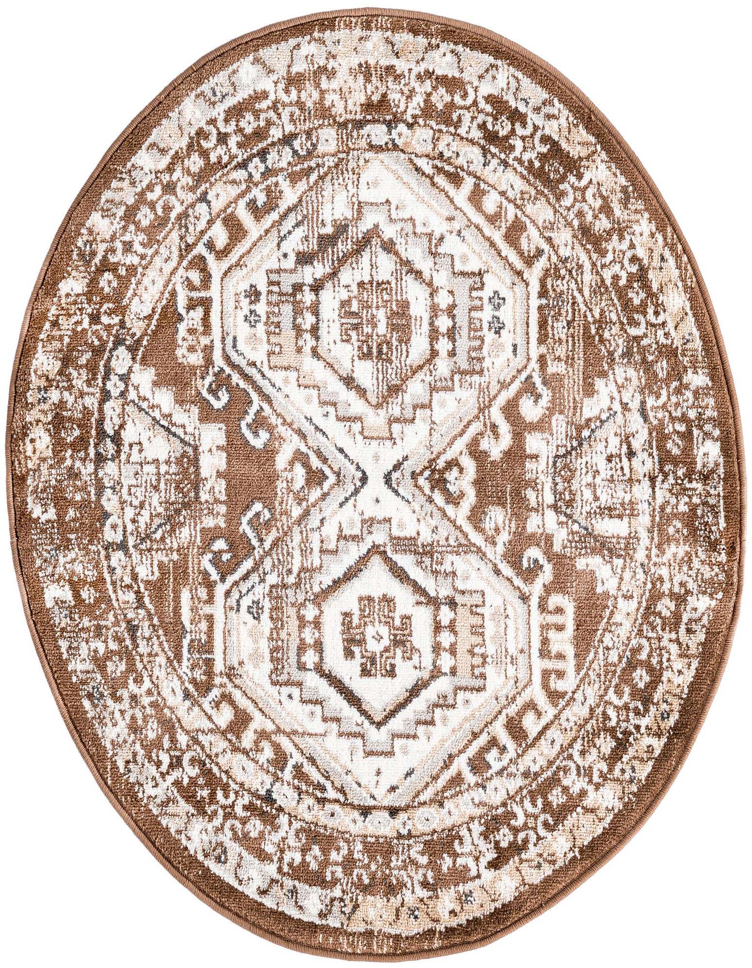 A 3' round Charlotte rug in brown and tan with a distressed traditional tribal pattern, featuring a central medallion design.
