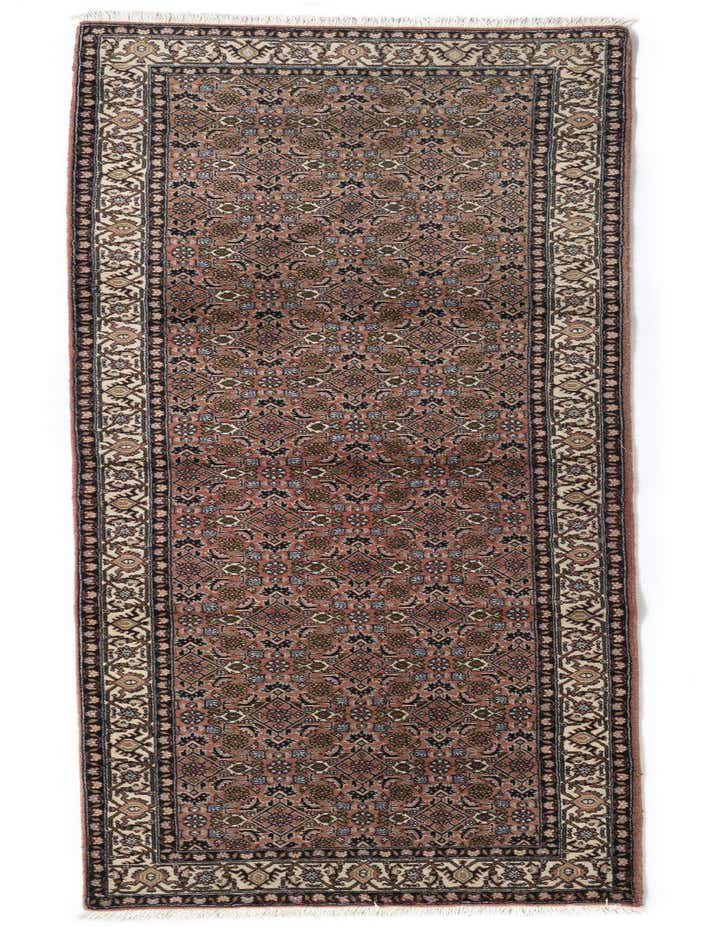 A 9 ft Bidjar runner rug in shades of brown and tan, featuring a detailed Persian pattern, ideal for a hallway.
