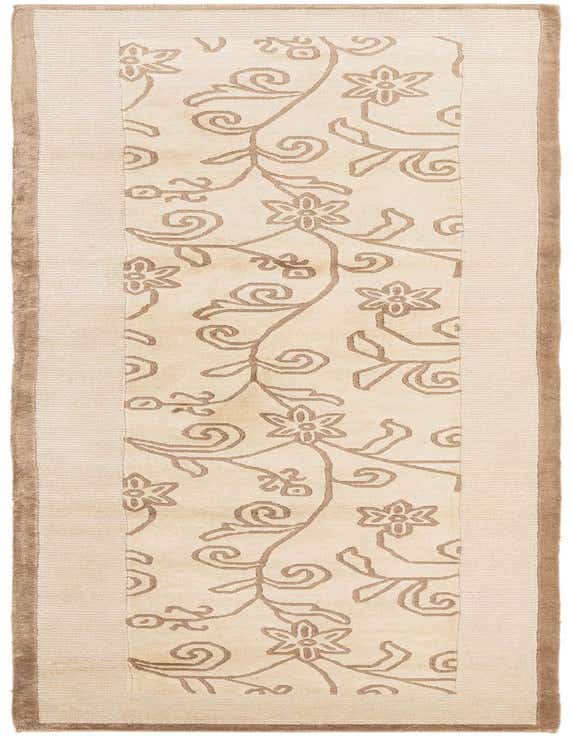 A 10 ft Darya runner rug in browns and tans, featuring an oriental floral pattern on a light background with a ribbed border.
