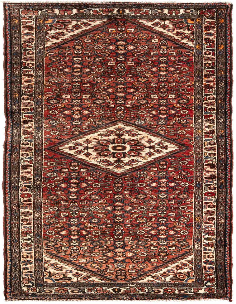A 10 ft Hamedan runner rug in shades of brown and tan, featuring a traditional Persian tribal pattern with a central medallion, ideal for a hallway.