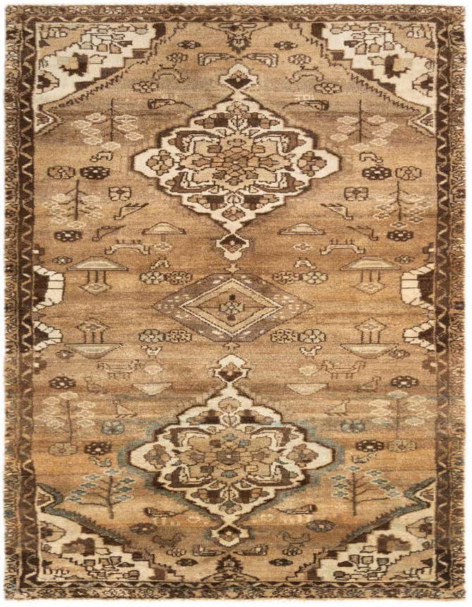 A handmade 8 ft runner rug in shades of brown and tan, featuring a traditional tribal pattern with medallions and intricate motifs, ideal for a hallway or kitchen.