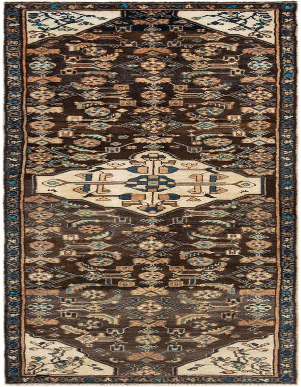 A long 8 ft runner rug with a dark brown background and intricate tribal patterns in cream, blue, and tan.