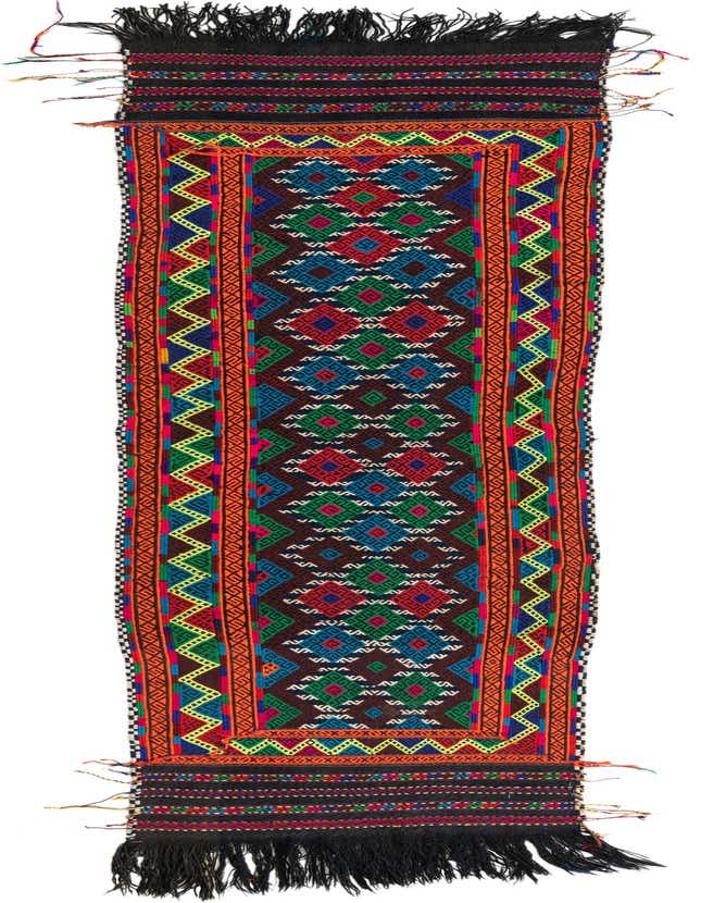 A vibrant 8 ft runner rug with a brown background, featuring colorful tribal geometric patterns in red, blue, green, and orange, with black fringed ends.