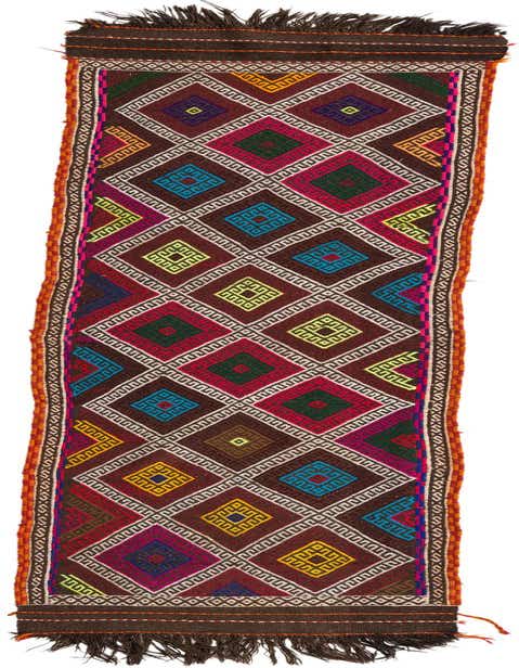 A 10 ft Kilim Fars runner rug with a brown background and colorful tribal geometric patterns, perfect for a hallway.