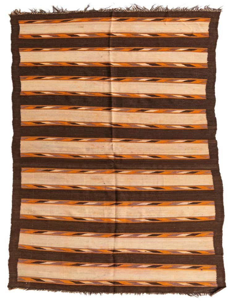 A 13 ft runner rug with a tribal stripe pattern in shades of brown, tan, and orange, suitable for a hallway.