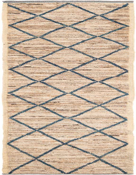 A long 11 ft runner rug featuring a natural brown and tan shag texture with a repeating navy blue tribal diamond pattern, perfect for a hallway.