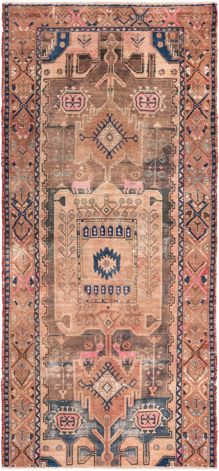 A 9 ft runner rug in traditional Persian style, featuring brown, tan, and blue tones with intricate patterns and pink animal motifs.