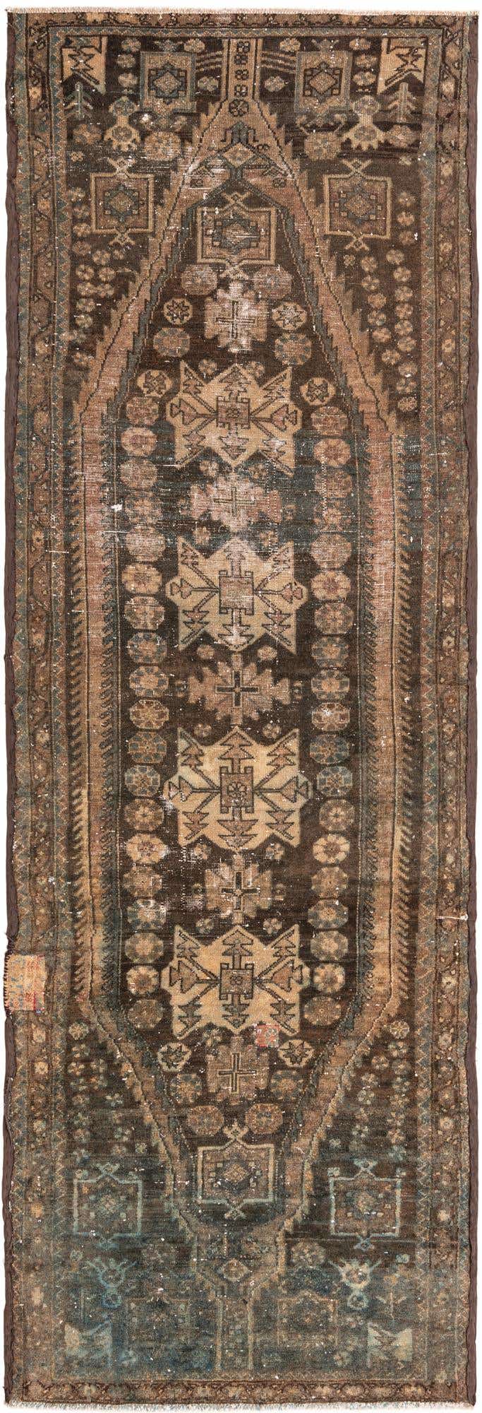 A 10 ft runner rug in shades of brown and tan with intricate Persian patterns, ideal for a hallway.