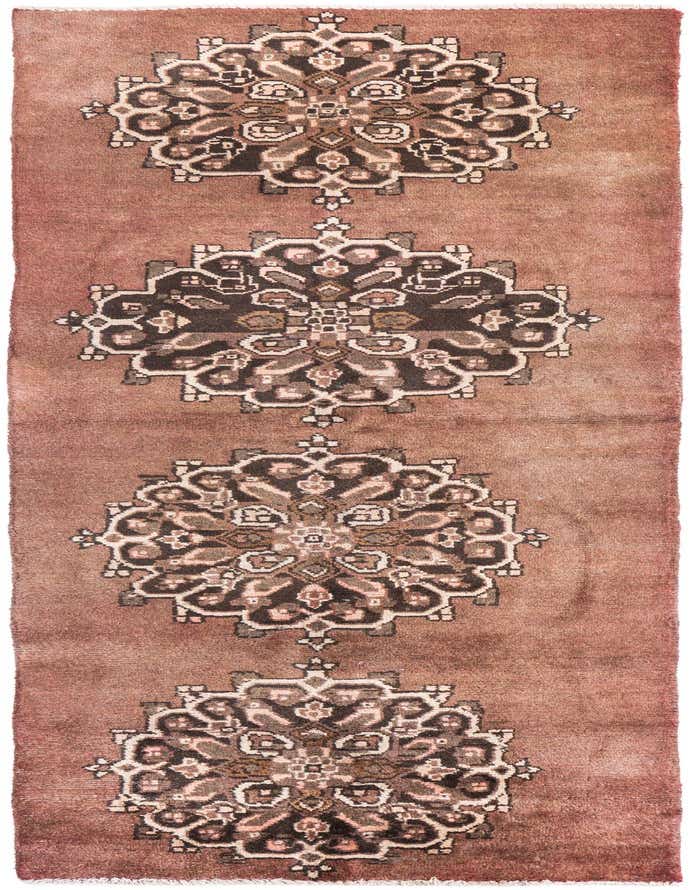 A 7 ft runner rug in shades of brown and tan, featuring four large, intricate medallion patterns, ideal for a hallway.