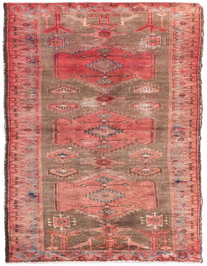 A 10 ft runner rug in shades of brown and tan with a distressed Persian medallion pattern and red, blue, and orange accents.
