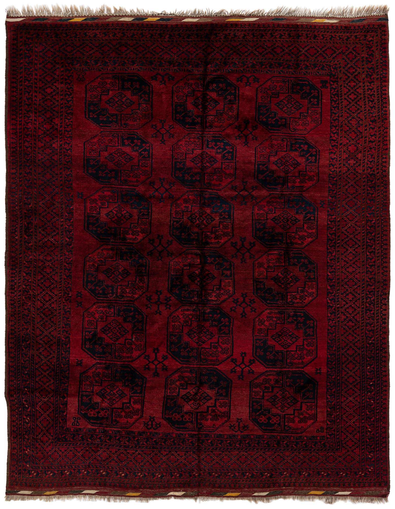 A handmade 8x10 rectangular Afghan Akhche wool rug featuring a deep red field with repeating dark blue tribal medallions and a complementary border.