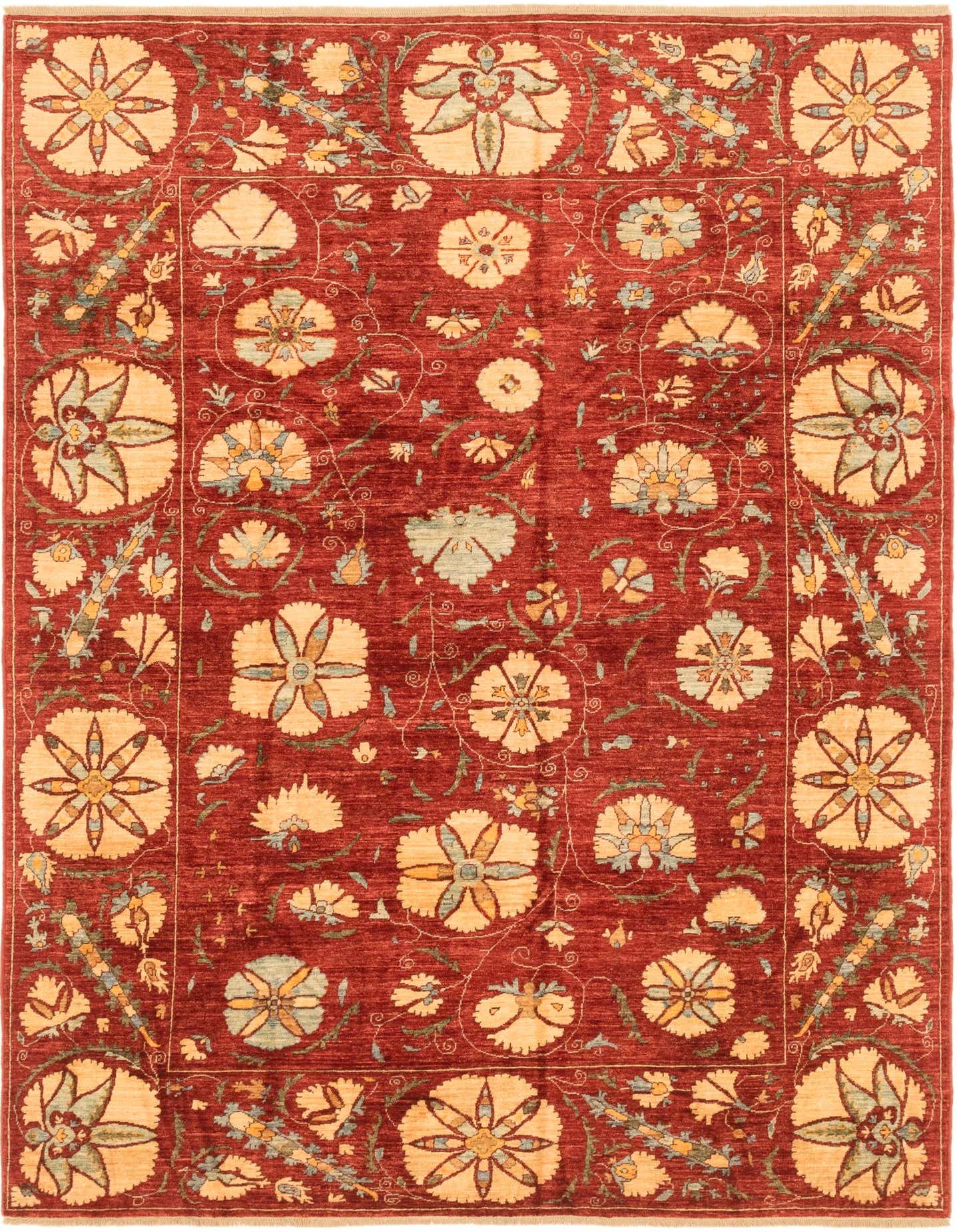 A 6x9 rectangular Ariana Ziegler rug in deep red with an intricate tribal floral pattern in cream, light blue, and green.