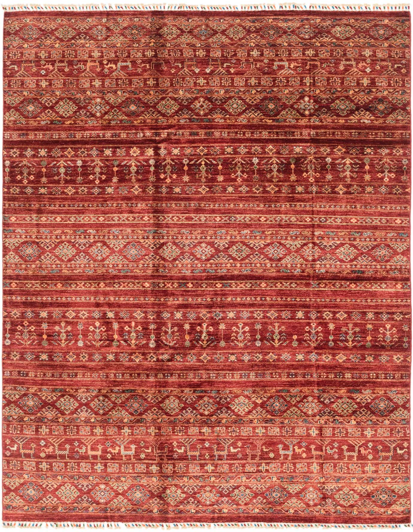 A 7x10 rectangular red area rug with a thin pile, featuring intricate tribal and Southwestern patterns in various shades of red, blue, and gold.