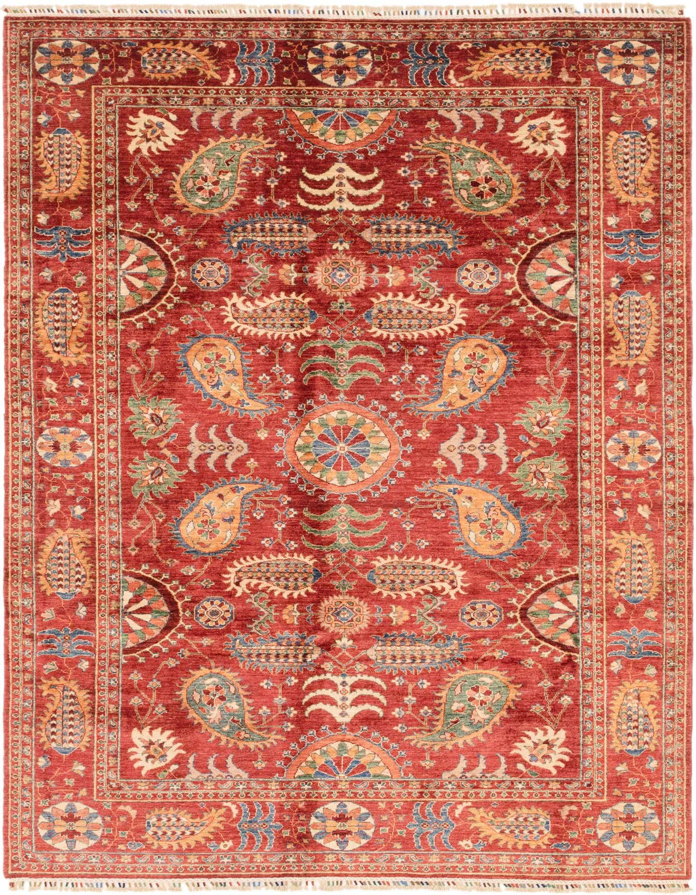 A 7x10 rectangular Ariana Ziegler rug featuring a traditional tribal pattern in rich reds with intricate blue, green, and gold accents.