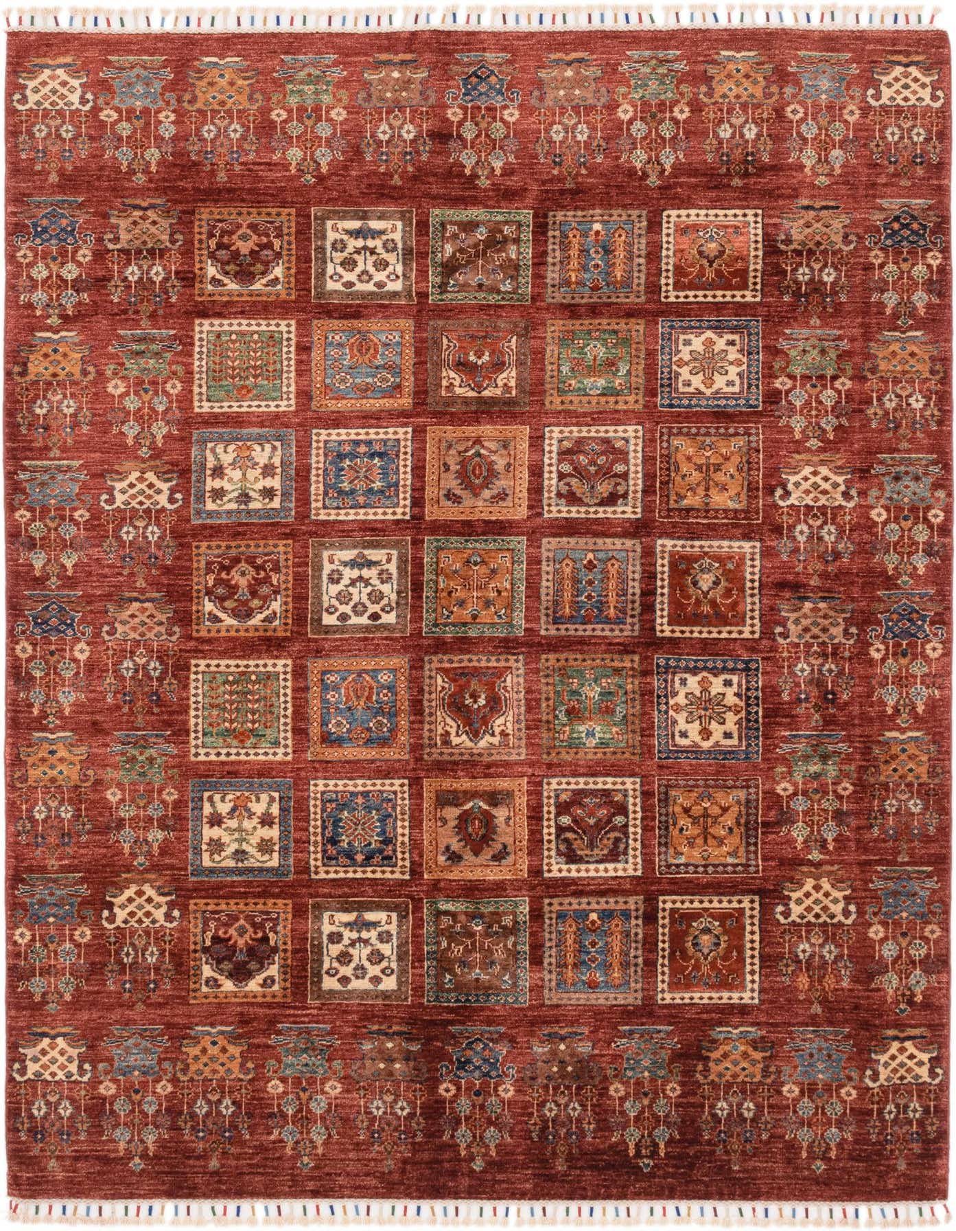 A 6x9 rectangular Rugs.com Ariana Ziegler rug featuring a deep red field with a grid of multicolored Southwestern and Oriental squares, bordered by intricate patterns and white fringe.