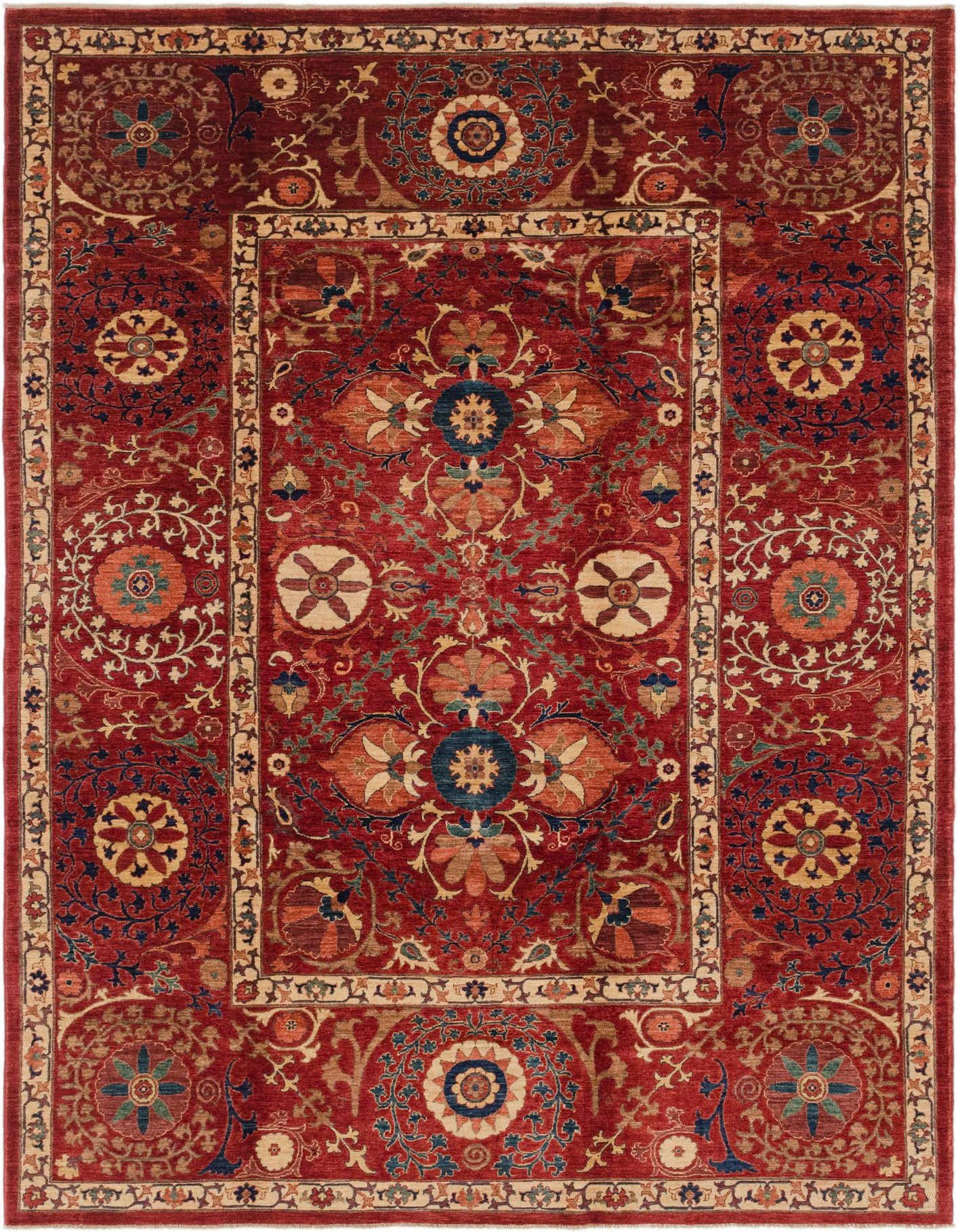 A 7x10 rectangular Ariana Ziegler rug featuring a rich red background with intricate traditional tribal patterns in blues, creams, and oranges.