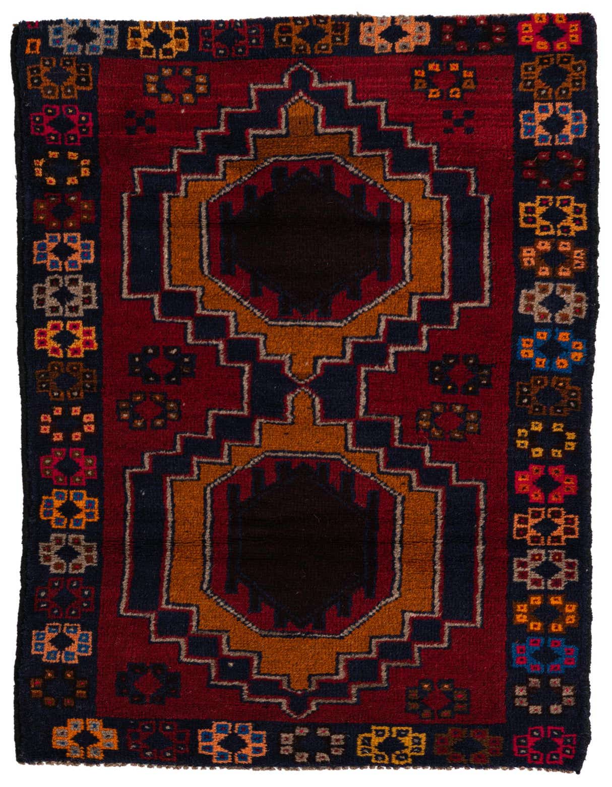 A 3x5 rectangular Balouch rug featuring a rich red field with a central navy and orange medallion, surrounded by colorful tribal motifs.