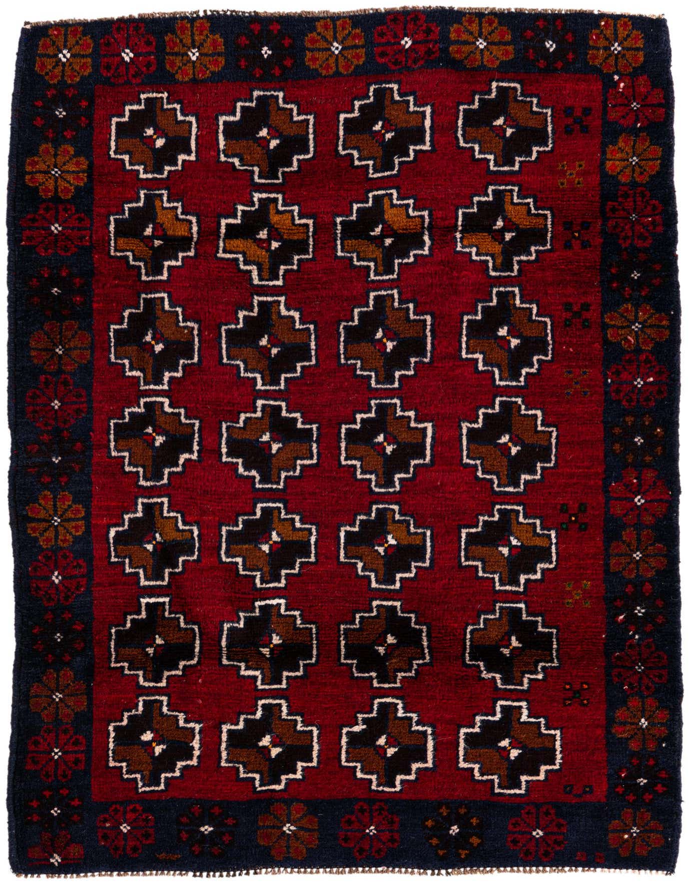 A 3x4 rectangular Balouch rug featuring a deep red field with a grid of black and brown medallion motifs, framed by a dark blue border with floral patterns.