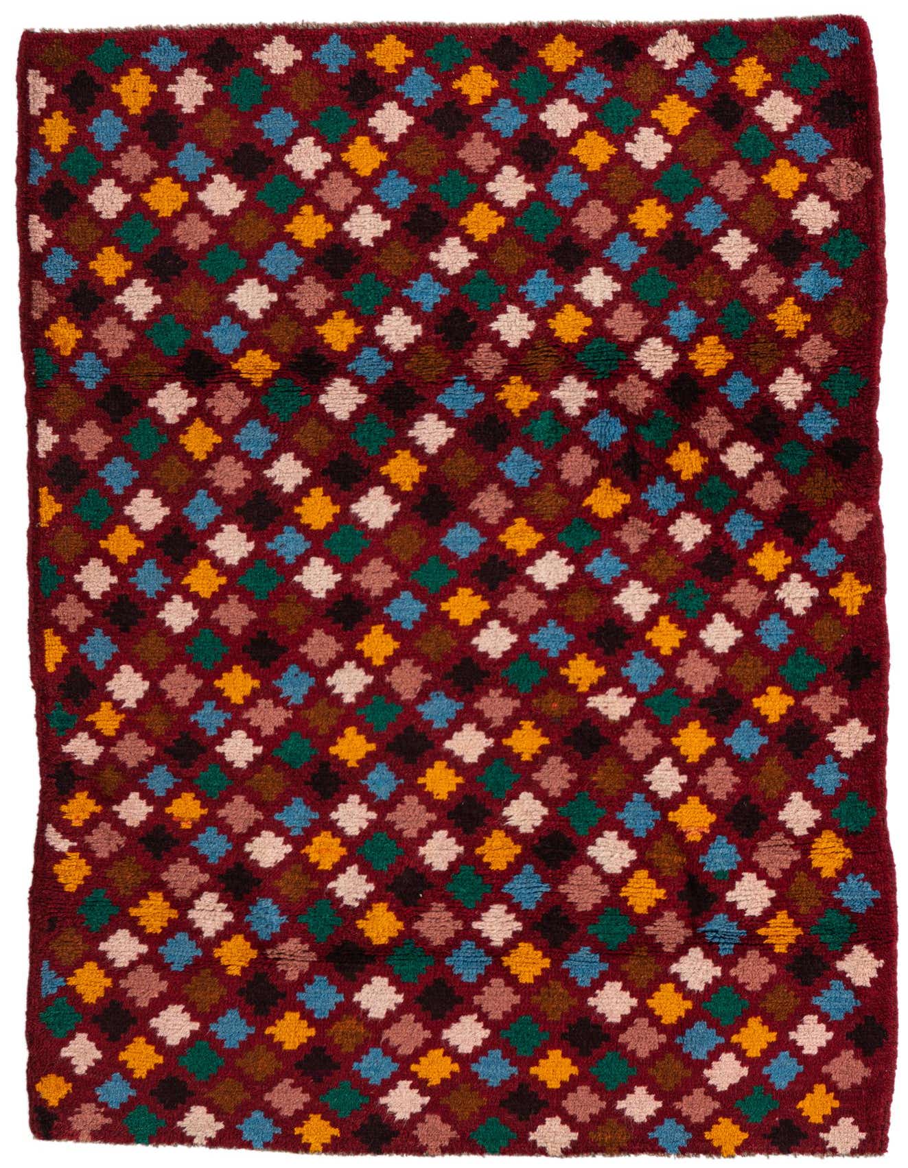 A 3x5 rectangular Balouch rug with a deep red background and a colorful tribal diamond pattern in blue, gold, green, and cream.