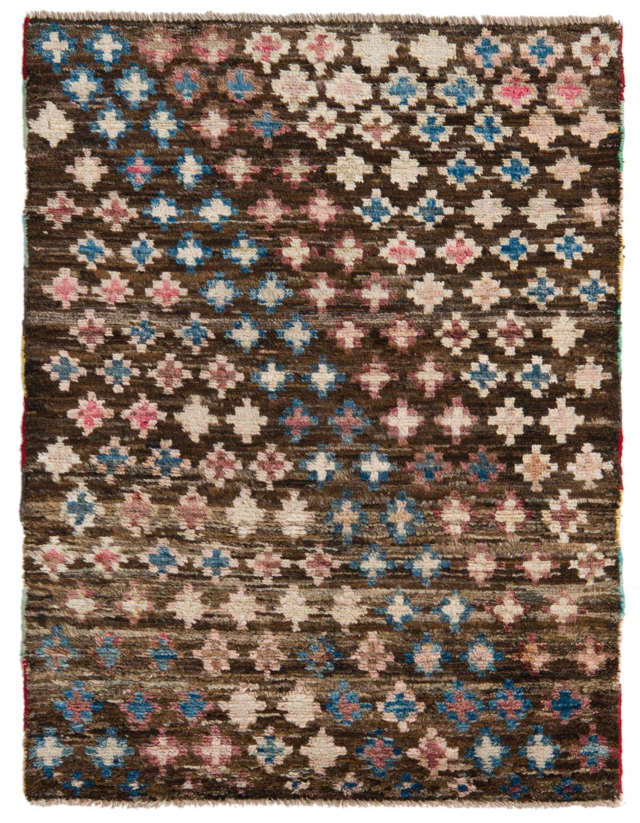 A rectangular 3x4 Balouch rug with a dark brown background and a repeating tribal pattern of red, blue, and cream abstract motifs.