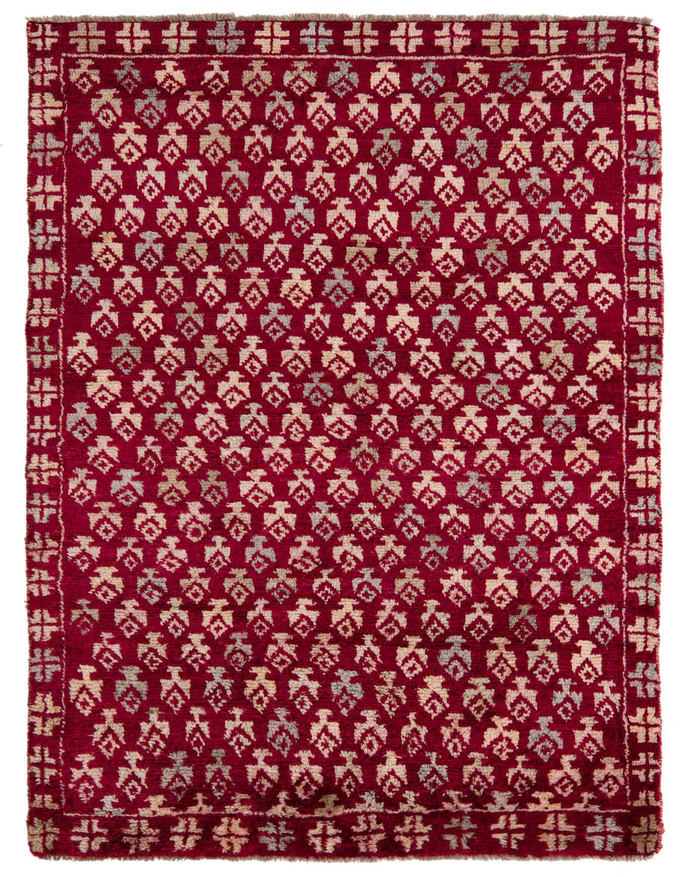 A 4x6 rectangular Balouch rug with a deep red background and repeating tribal motifs in cream and light blue.