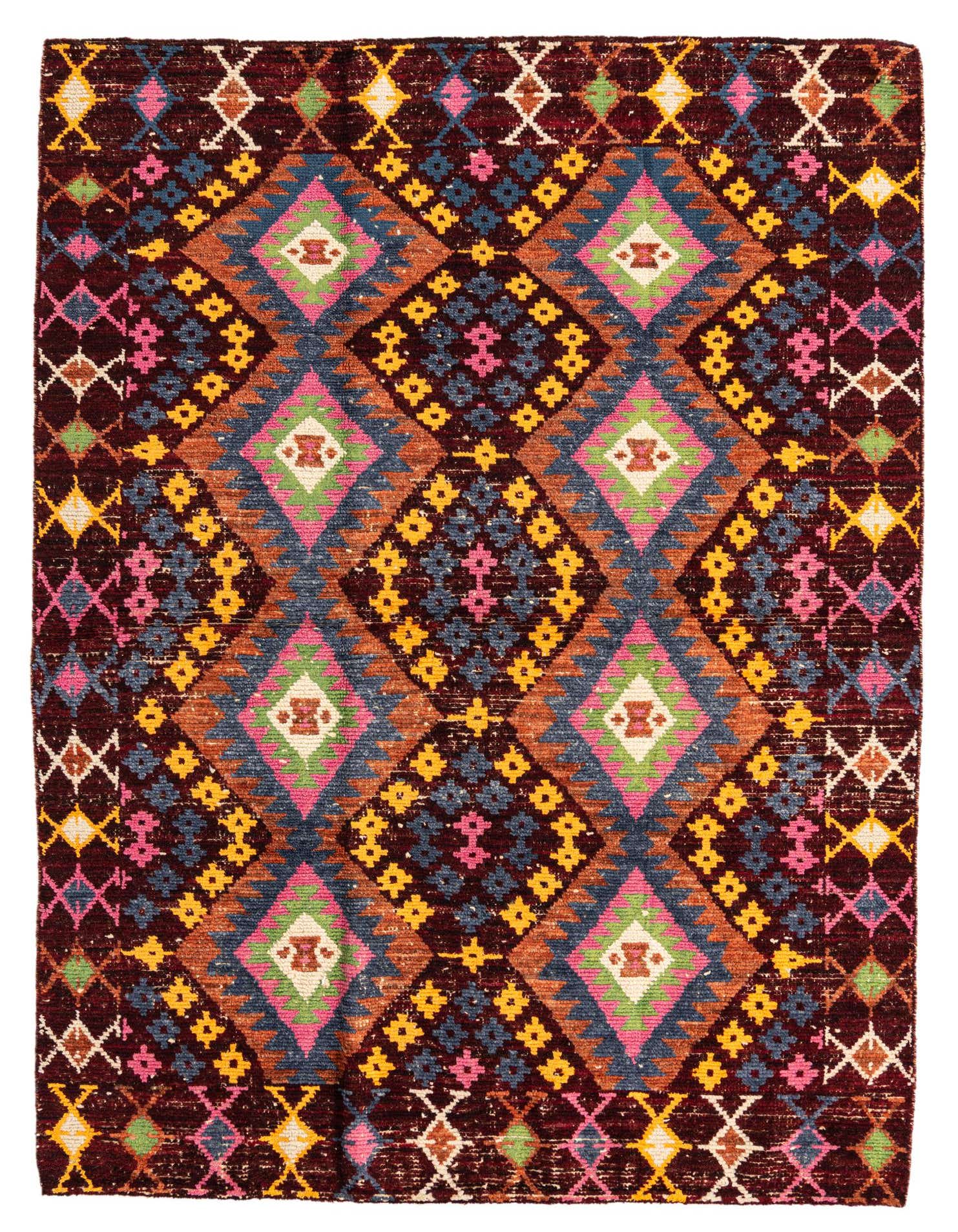 A 5x8 rectangular Darya Collection rug featuring a vibrant, multi-color geometric and abstract pattern with dominant reds, pinks, blues, and yellows.