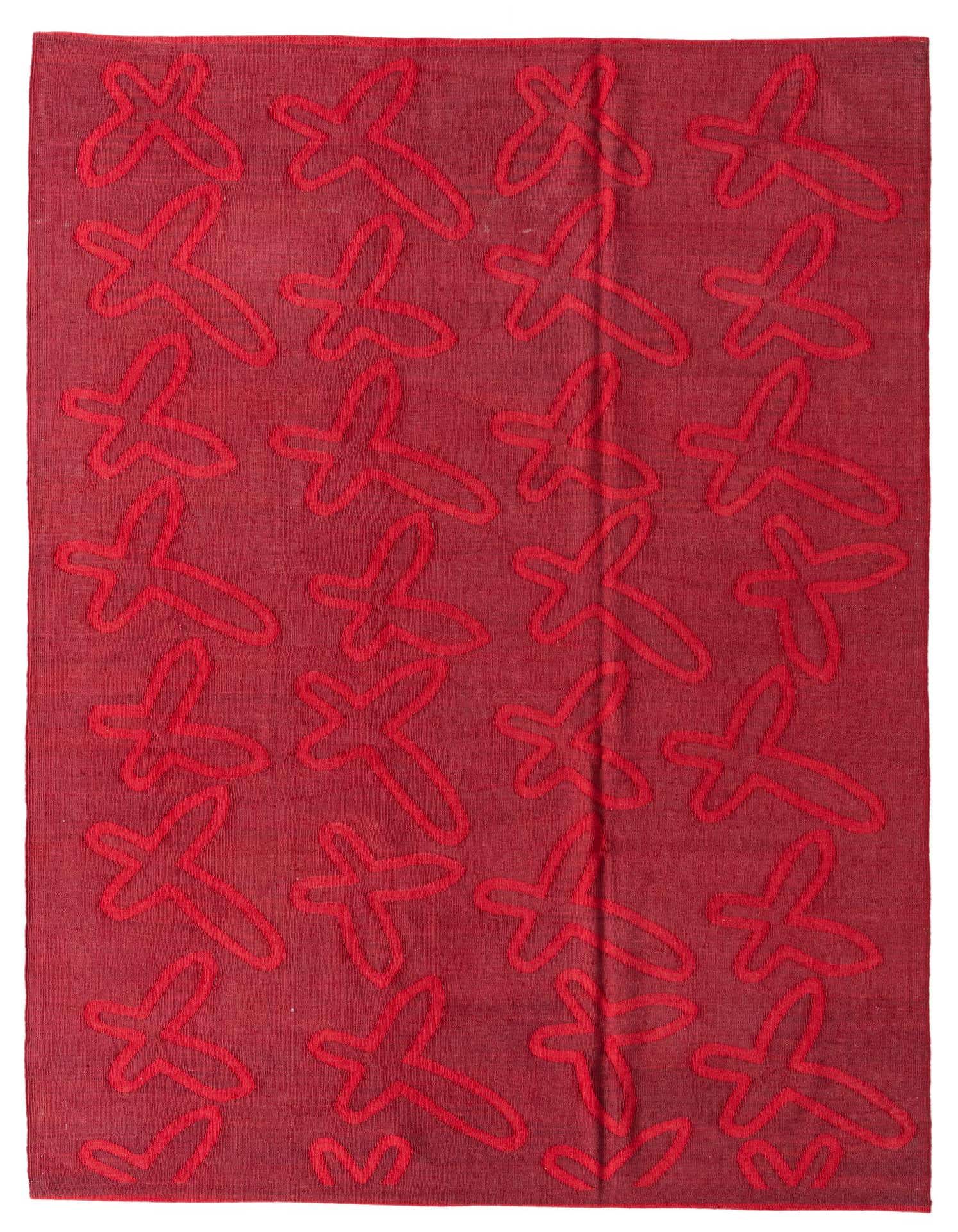 A 5x8 rectangular red wool rug with a modern tribal pattern of abstract, outline-style shapes in a slightly brighter red.